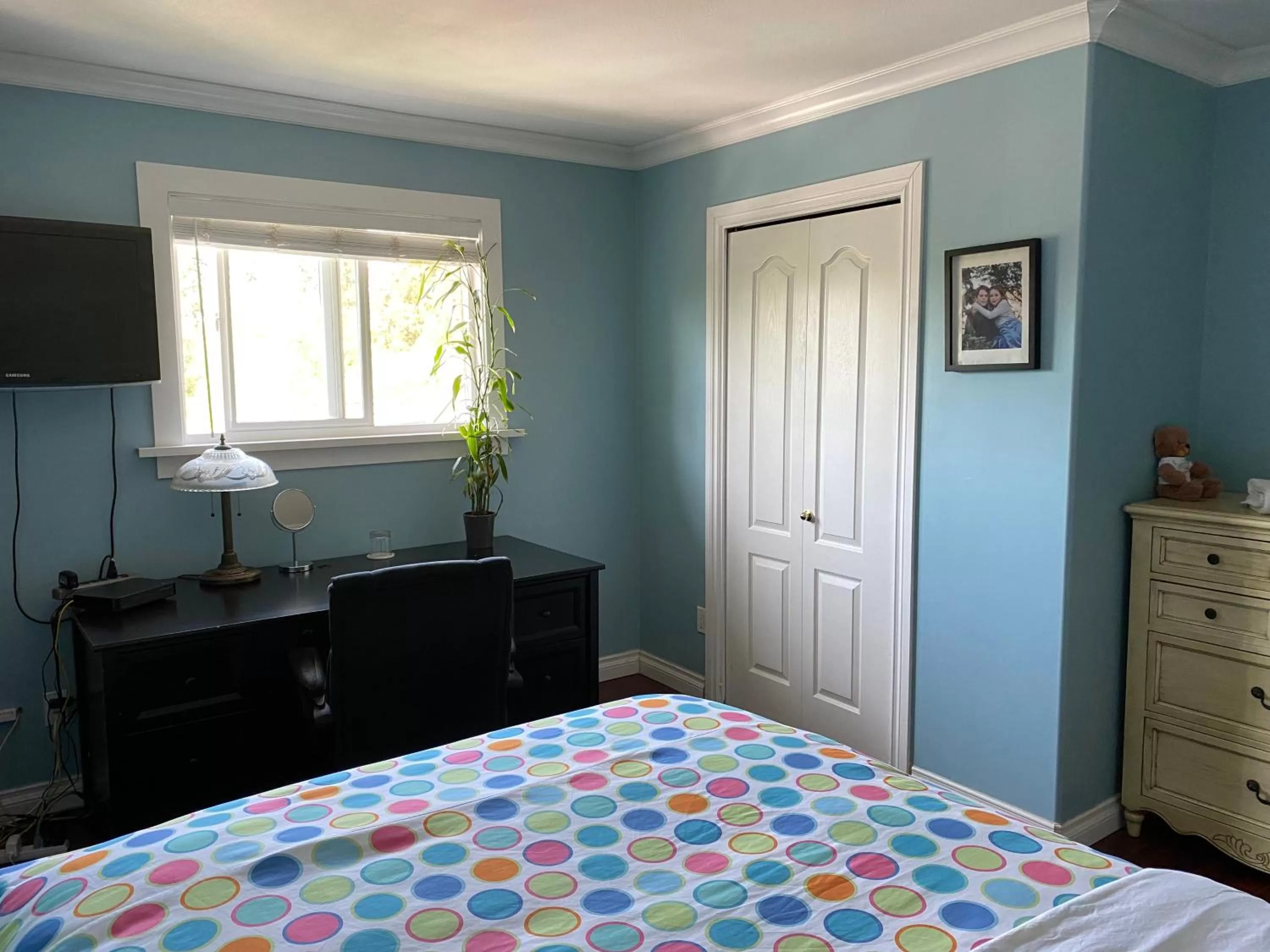Bed in Jane's private rooms with shared washroom