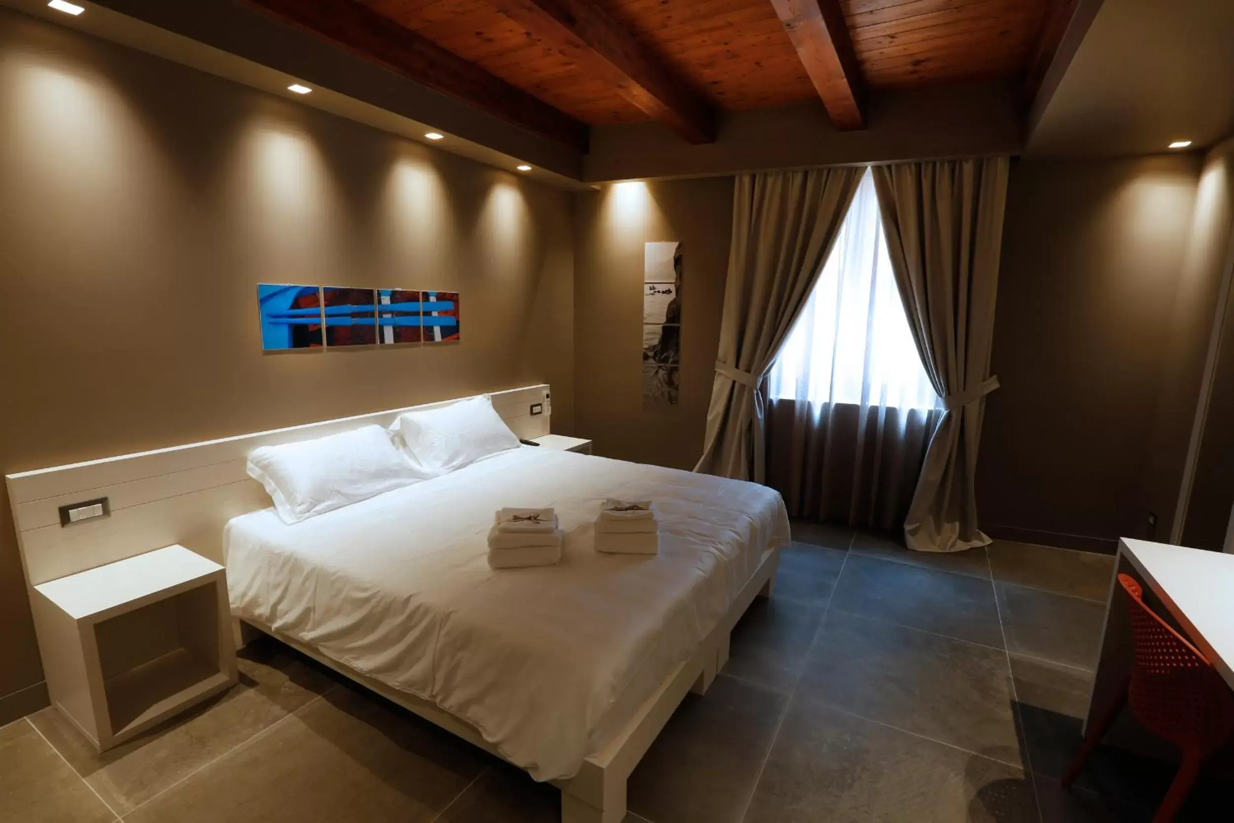 Bed in Il Casato Deluxe Rooms