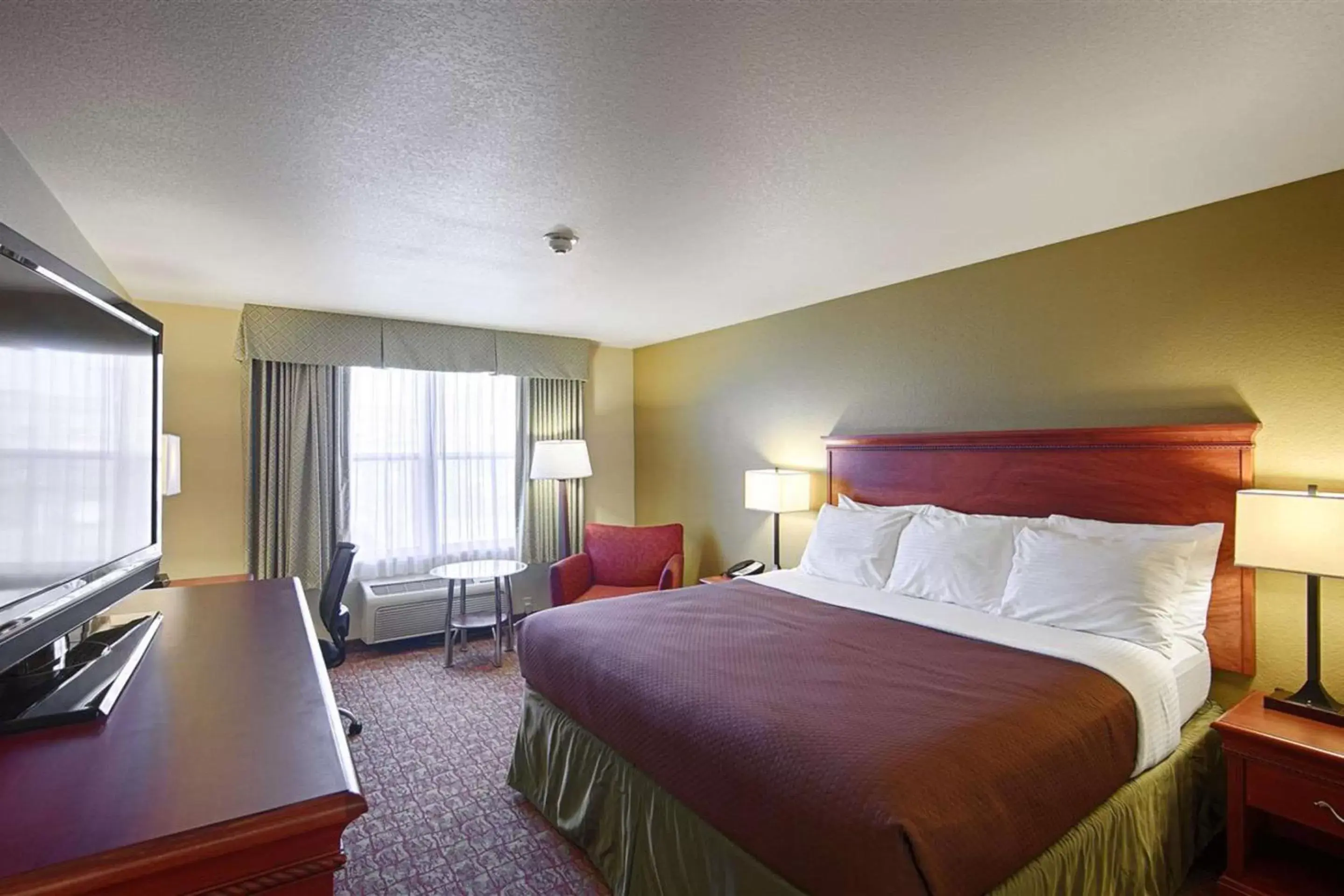 Photo of the whole room, Bed in Heritage Hotel and Suites