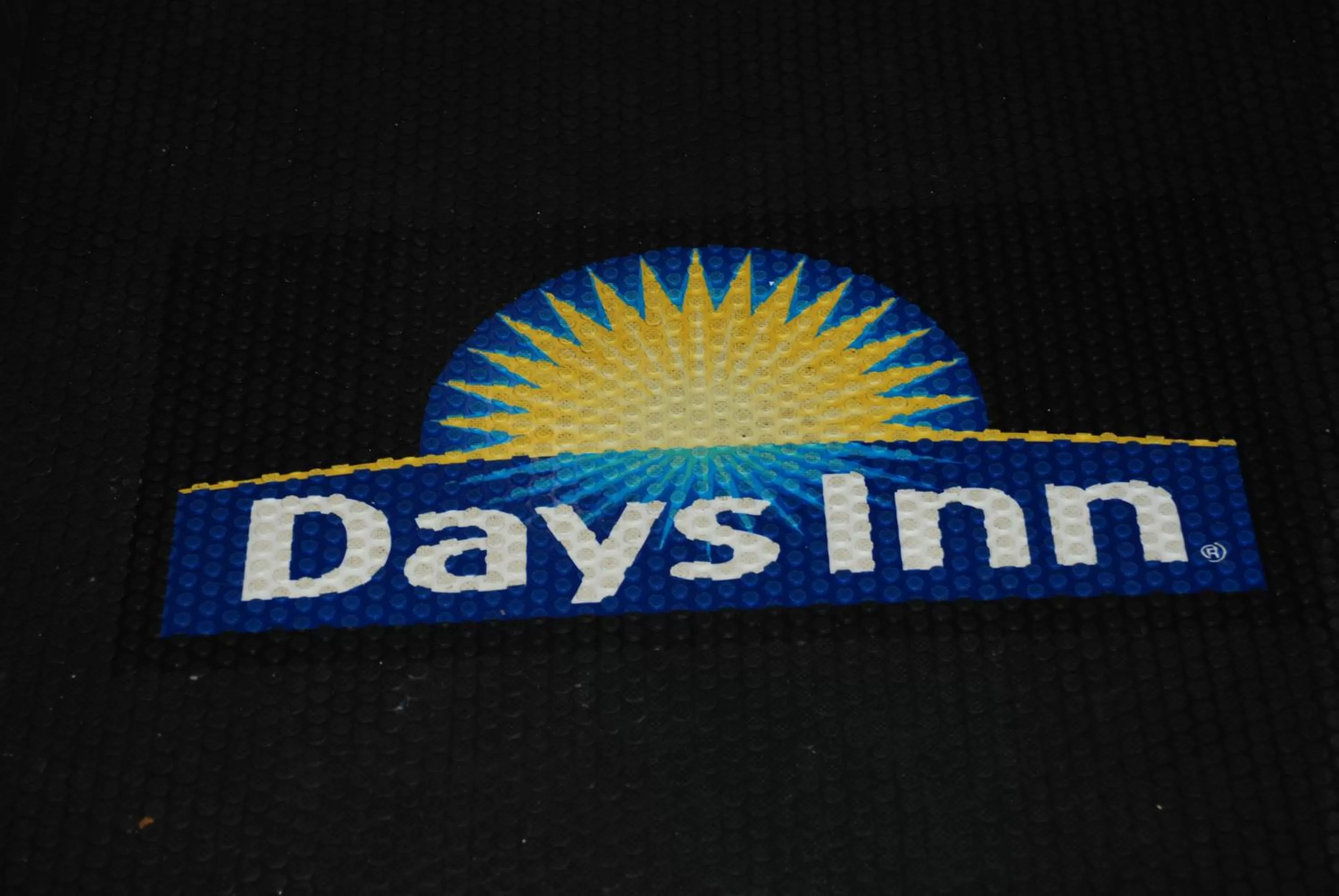 Property logo or sign in Days Inn by Wyndham Dyersburg