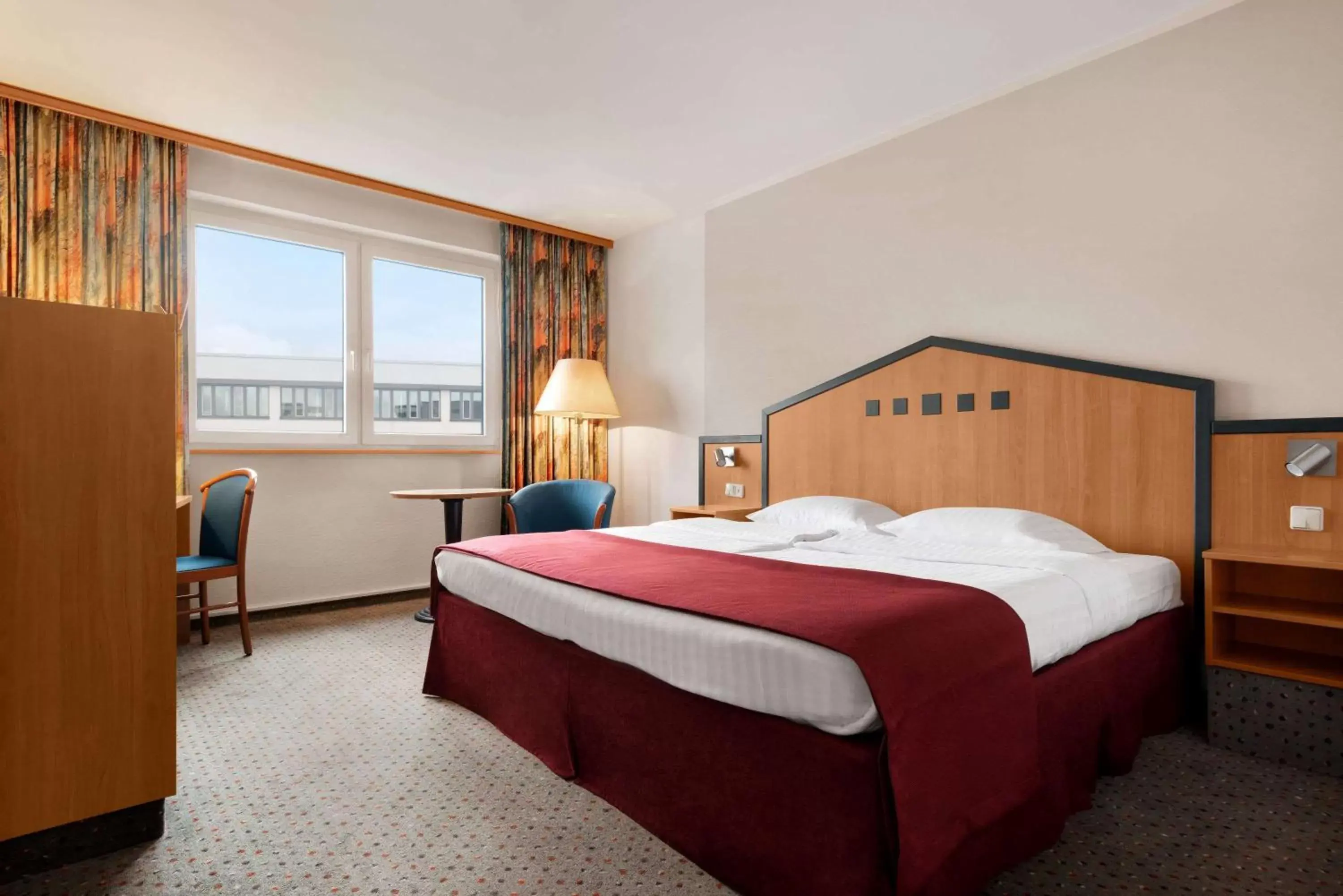 Photo of the whole room, Bed in Ramada by Wyndham Bottrop City