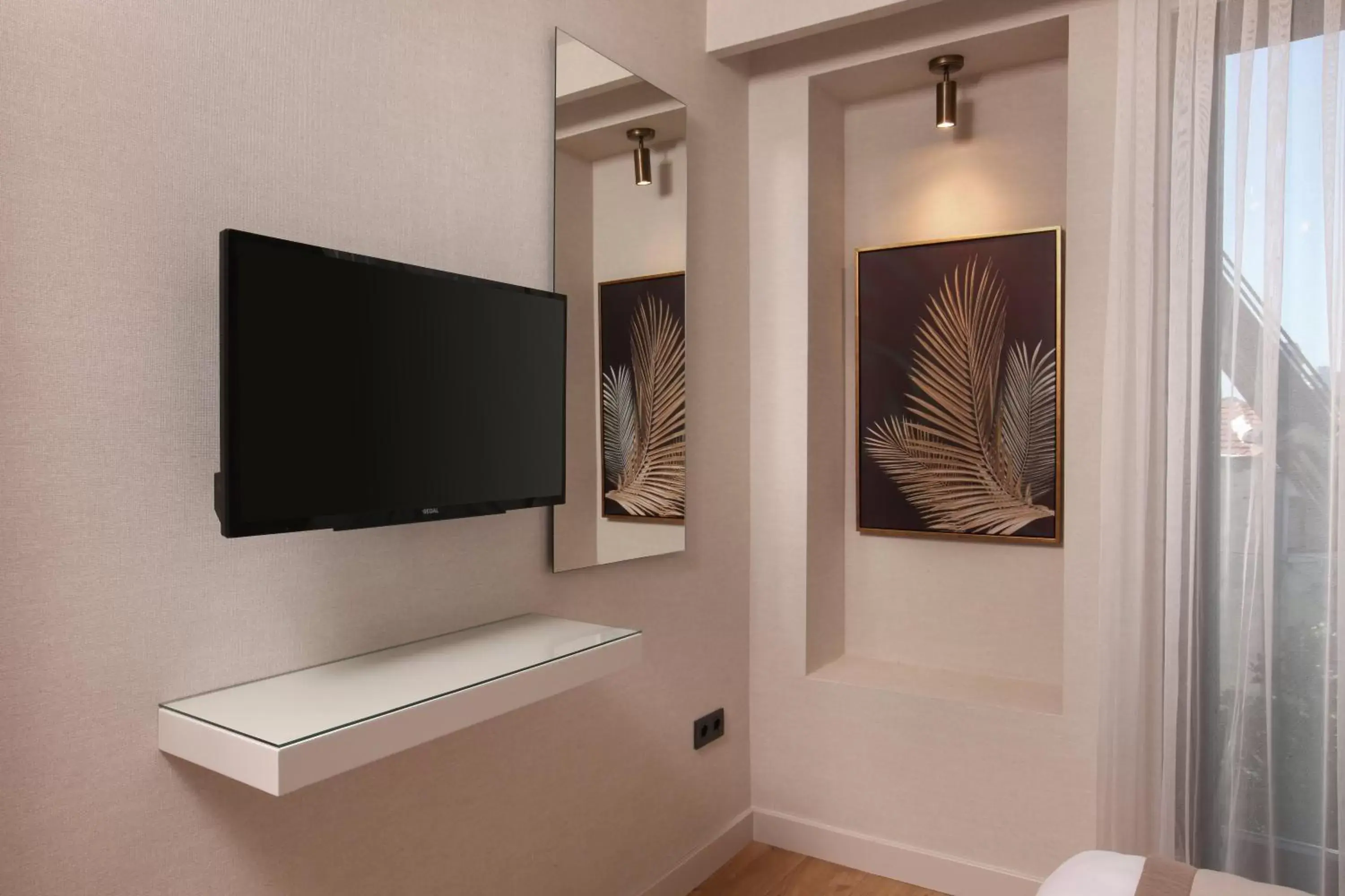 TV and multimedia, TV/Entertainment Center in The Pearl Suites