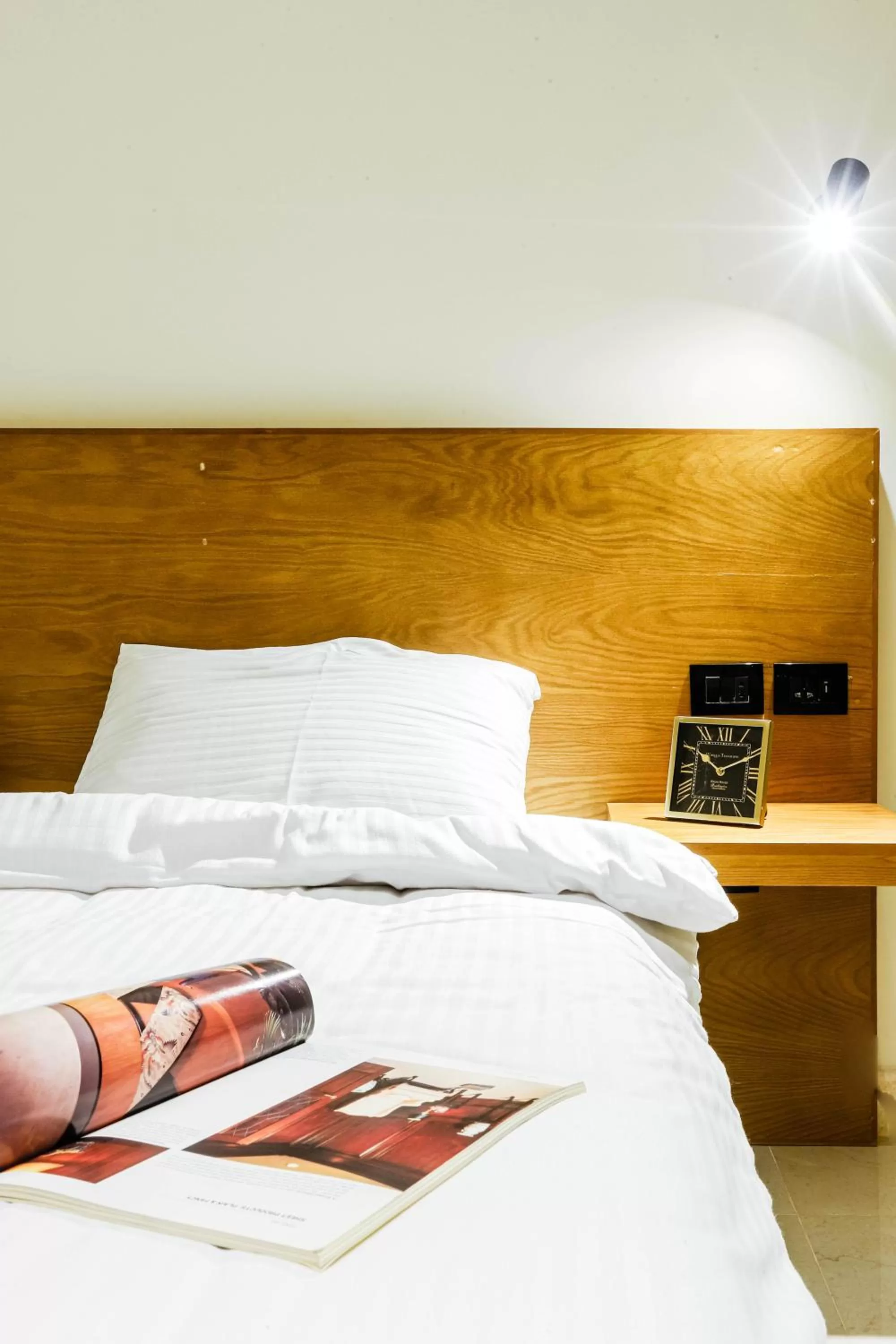 Bed in NewCity Hotel & Suites