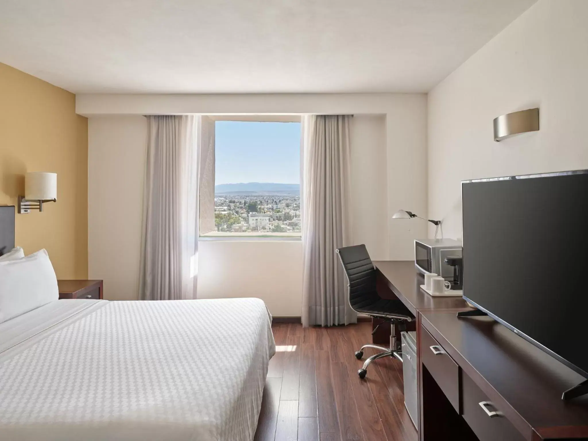 Photo of the whole room, TV/Entertainment Center in Fiesta Inn Durango