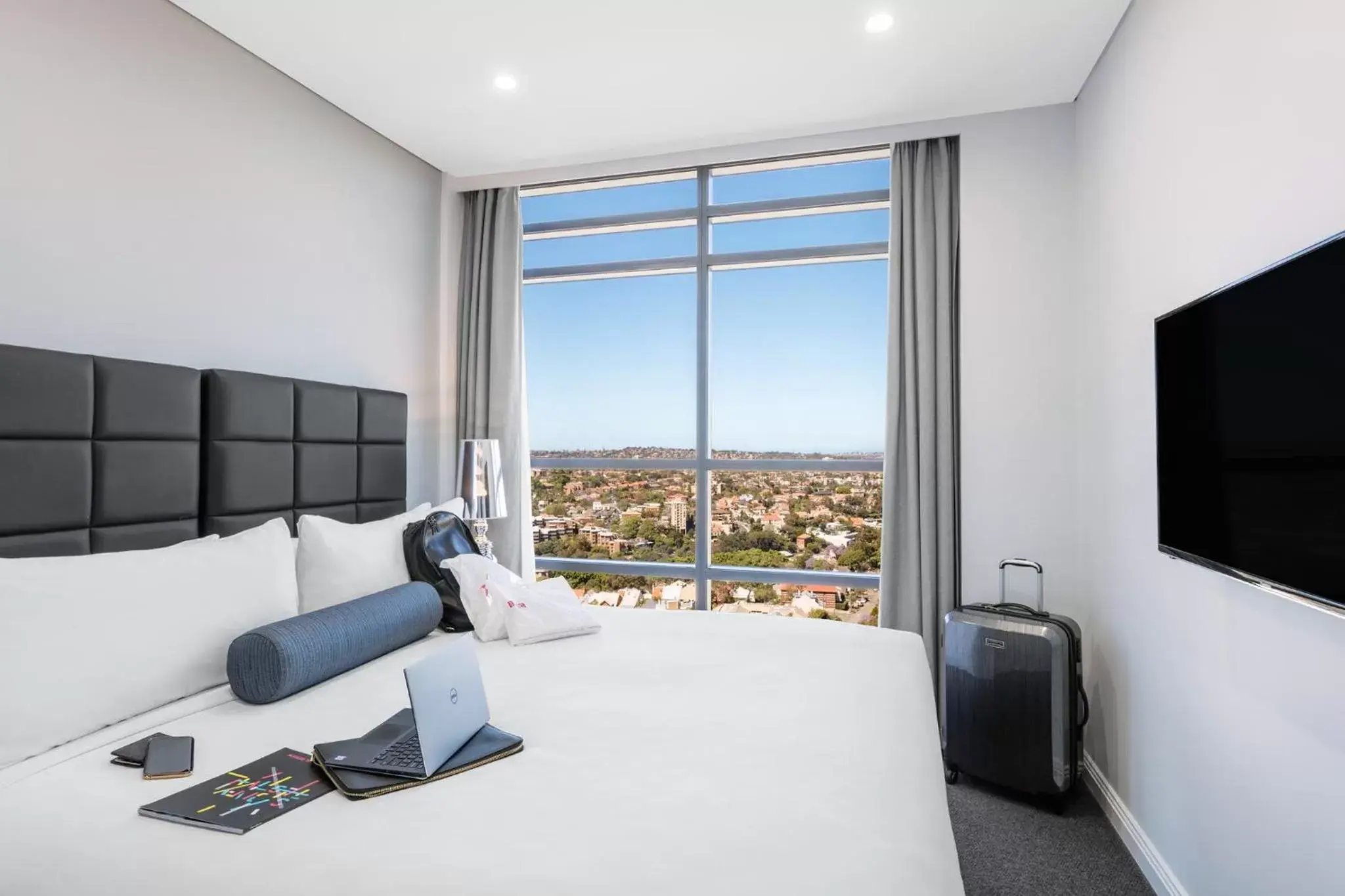 Bed in Meriton Suites North Sydney