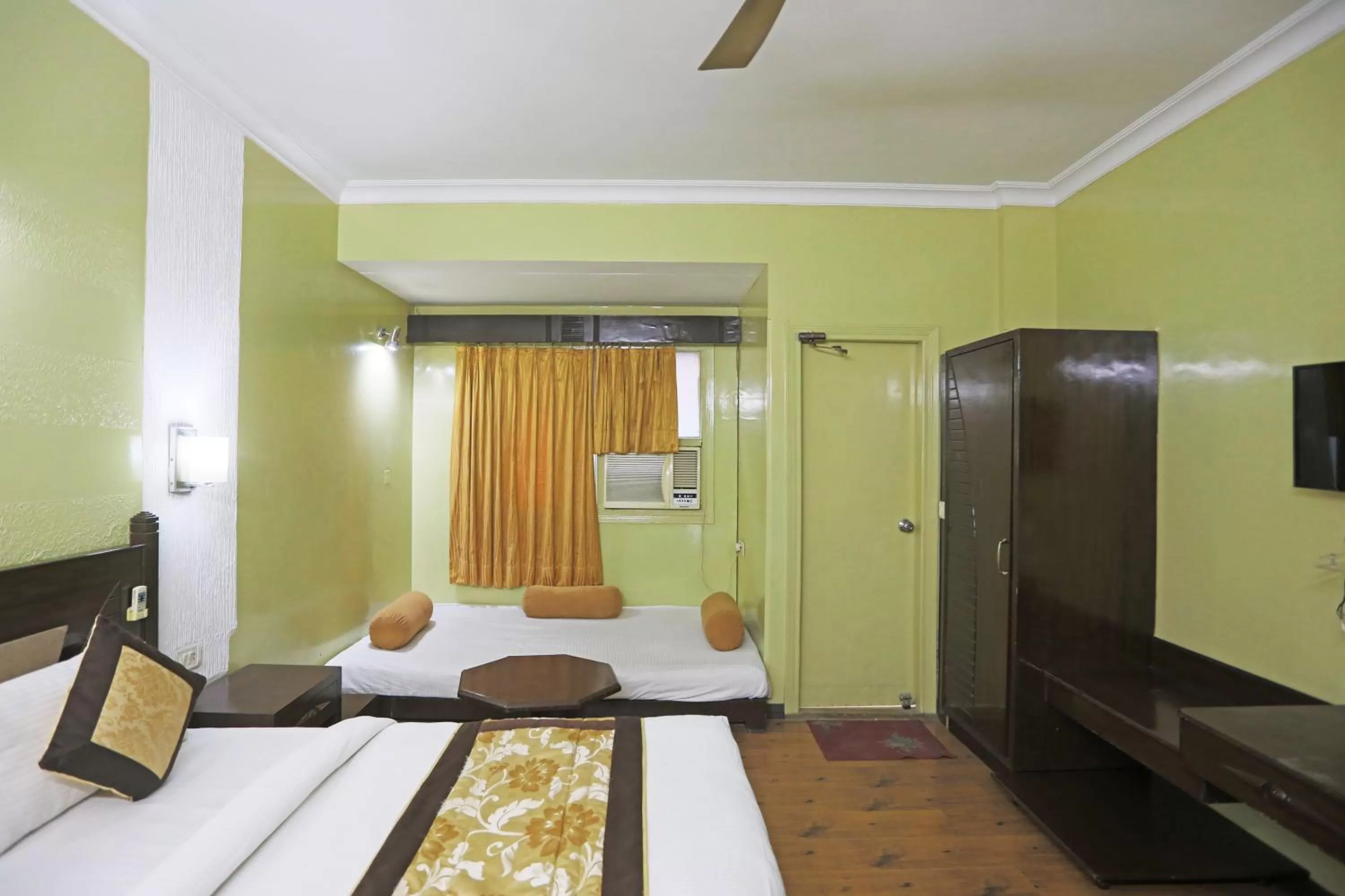 Photo of the whole room in Hotel The Tourist - 1 min from New Delhi Railway Station