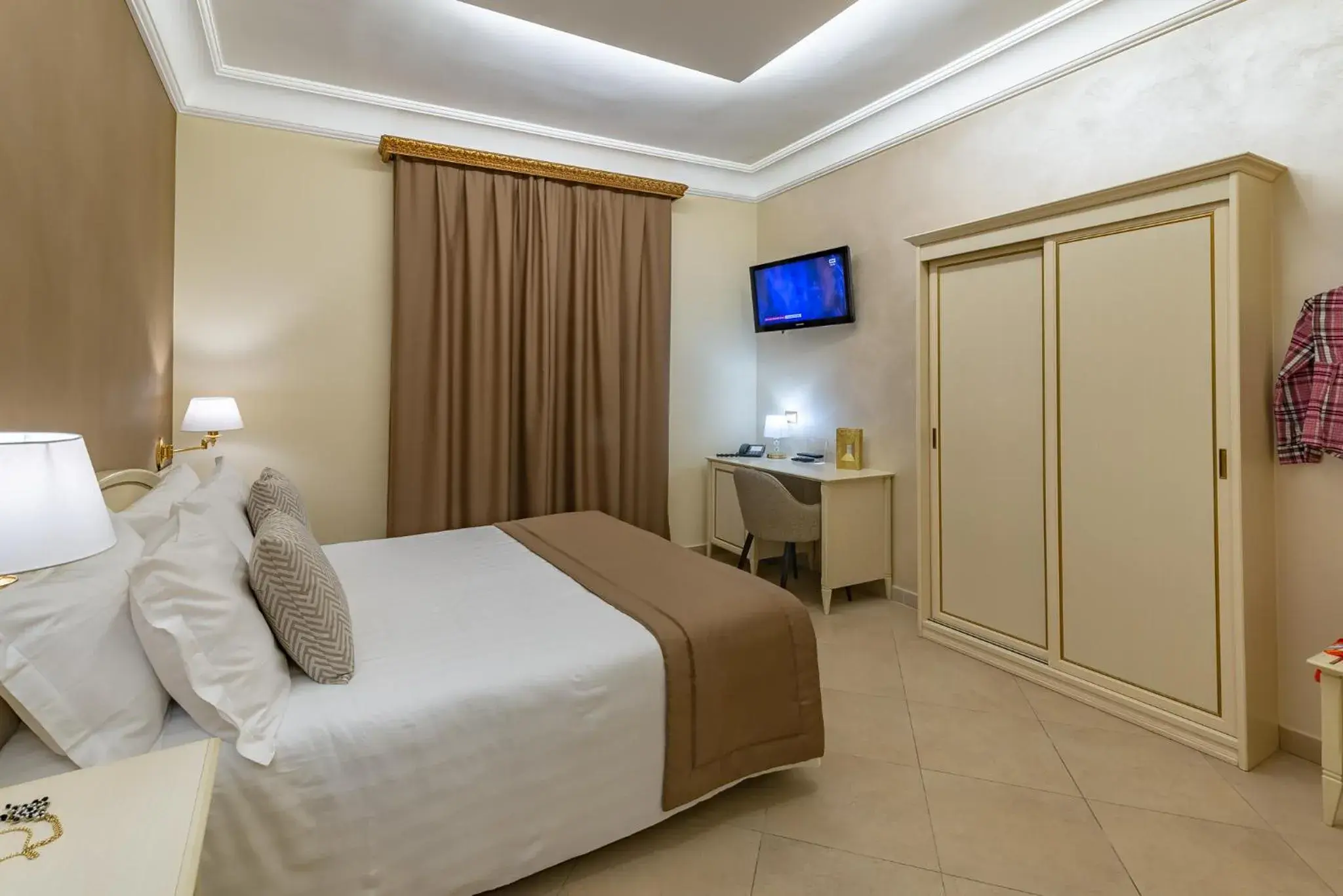 Bed in Vittorio Emanuele Boutique Hotel