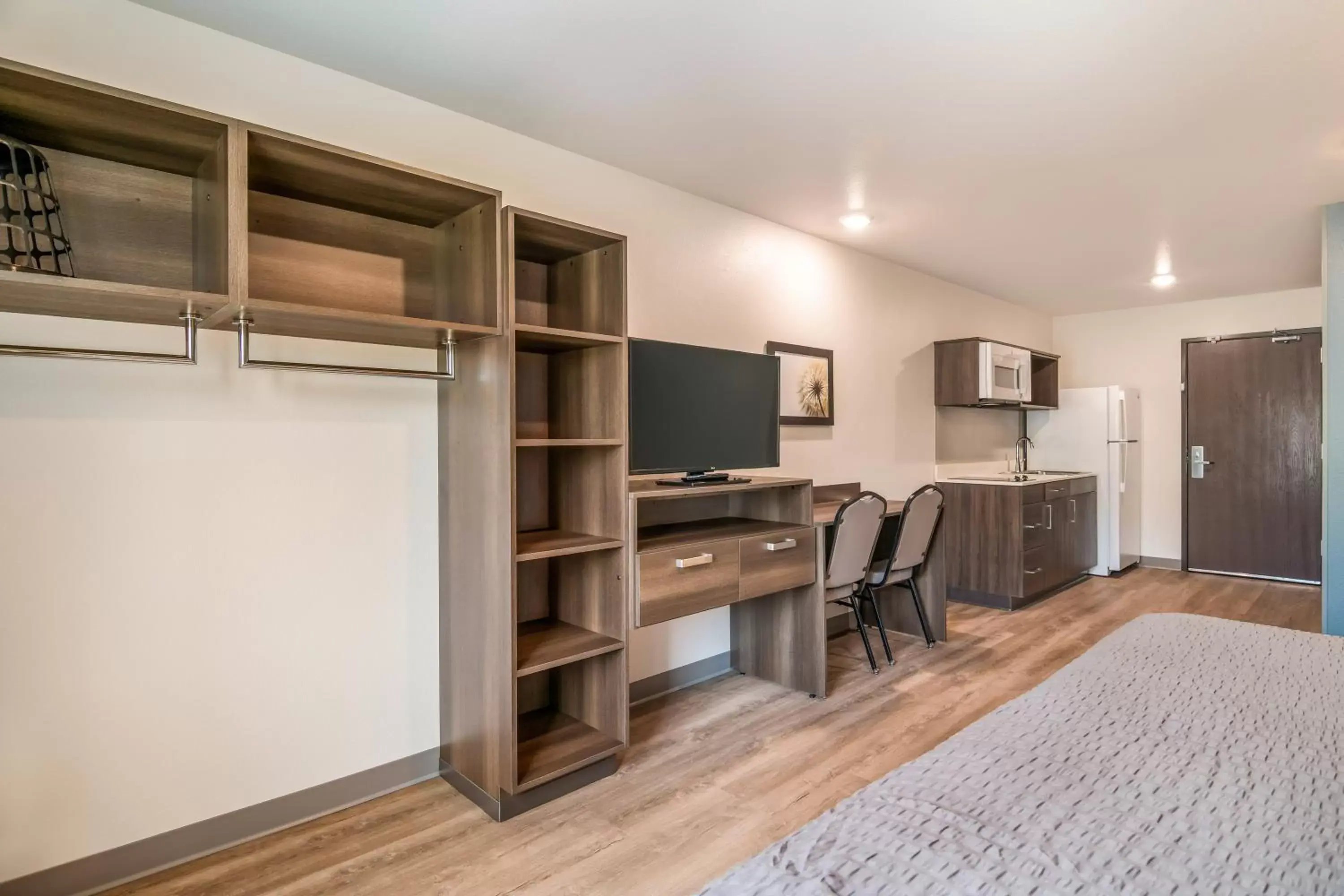 Photo of the whole room, TV/Entertainment Center in WoodSpring Suites Broomfield-Westminster