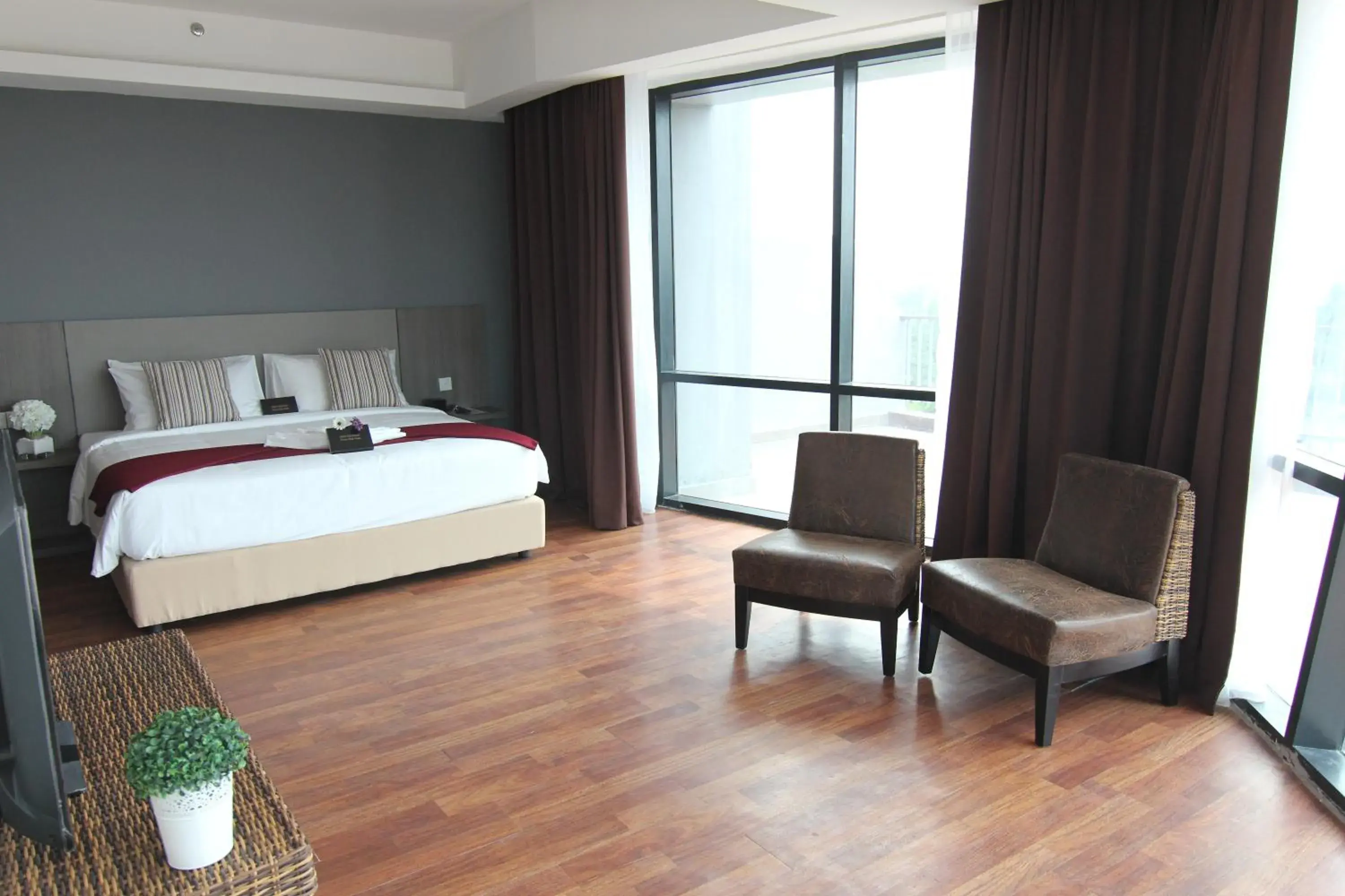 Bed in Nexus Business Suite Hotel