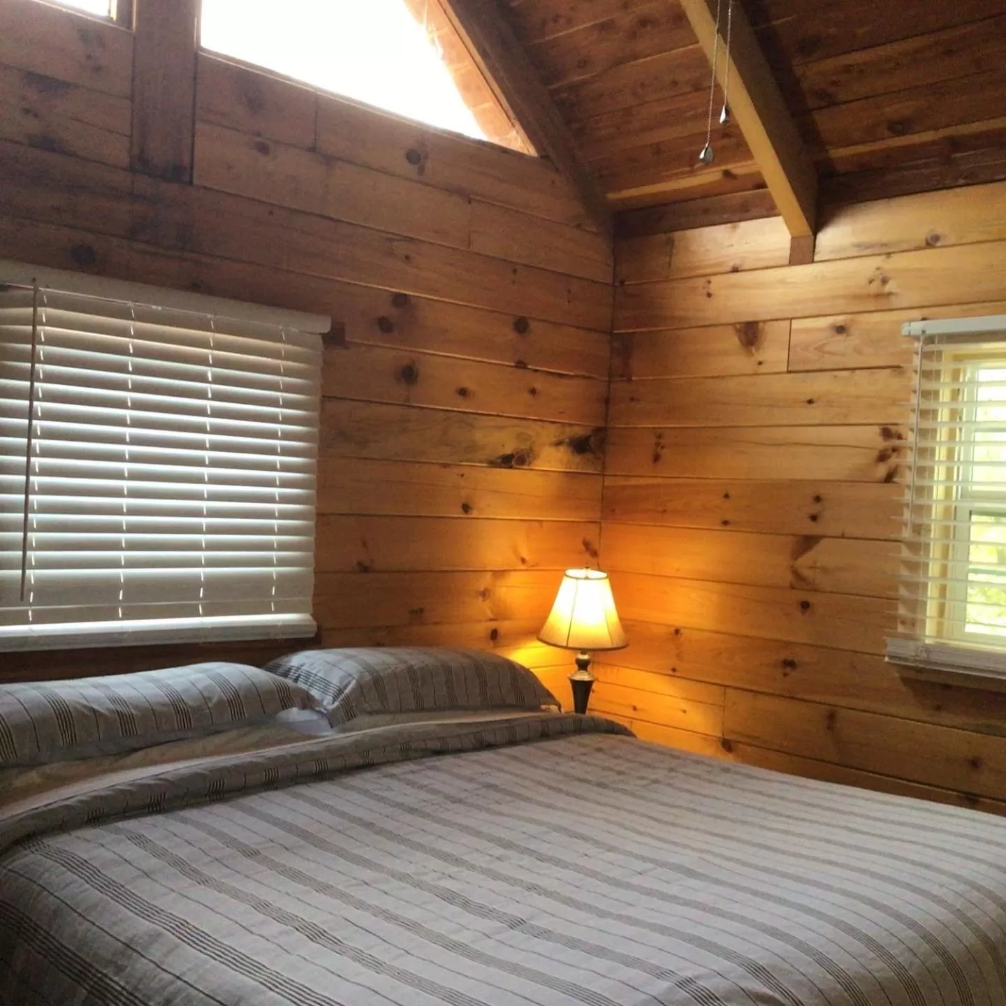 Bed in Kozy Haven Log Cabin Rentals