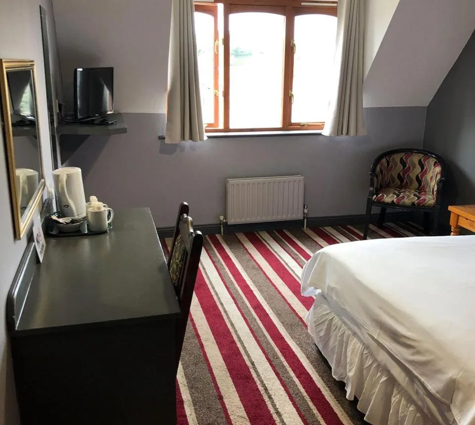 Bed in The Airman Hotel