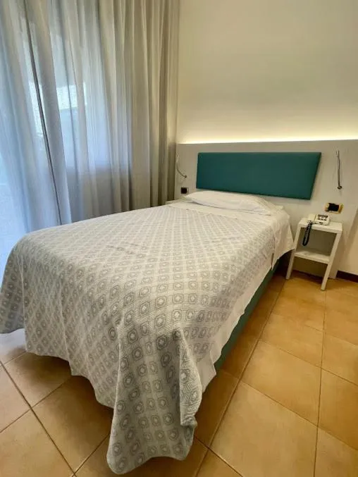 Bed in Hotel Corallo