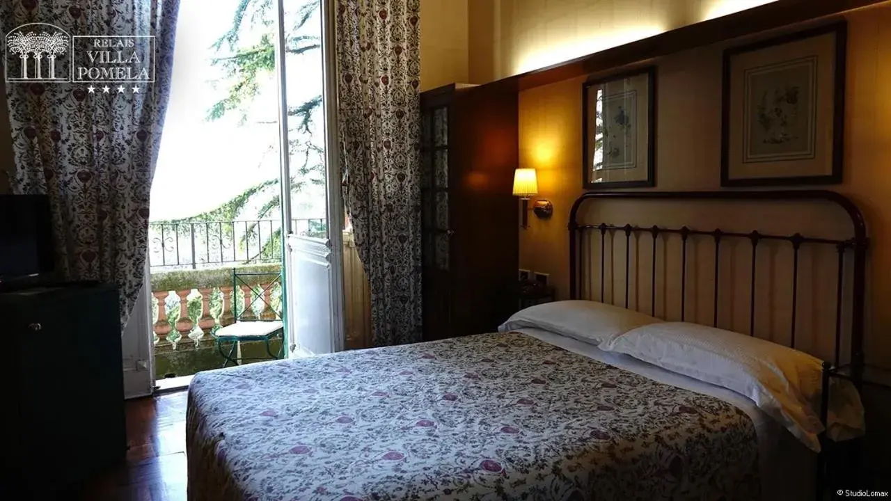 Bed in Relais Villa Pomela
