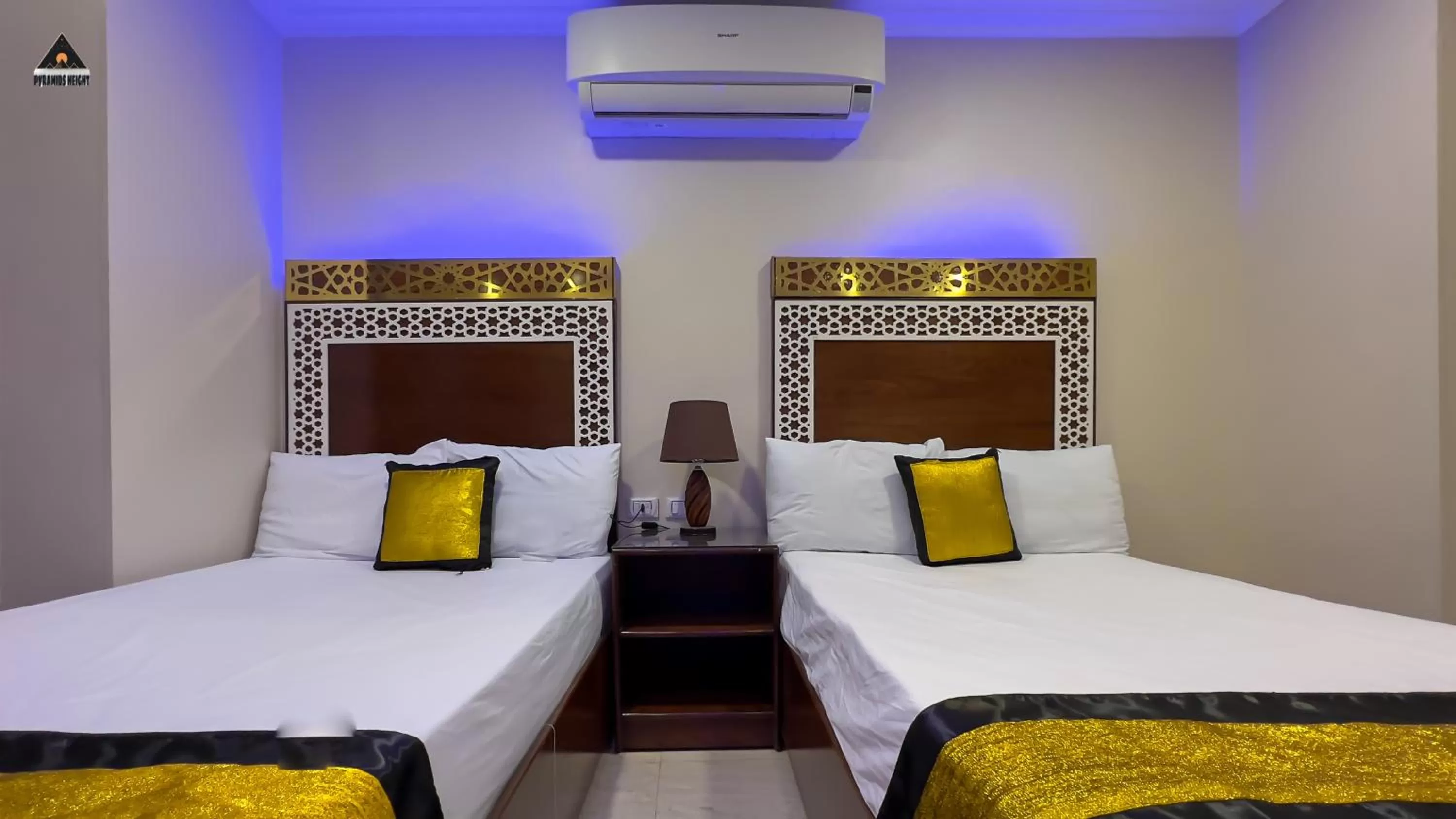 Bed in Pyramids Height Hotel & Pyramids Master Scene Rooftop