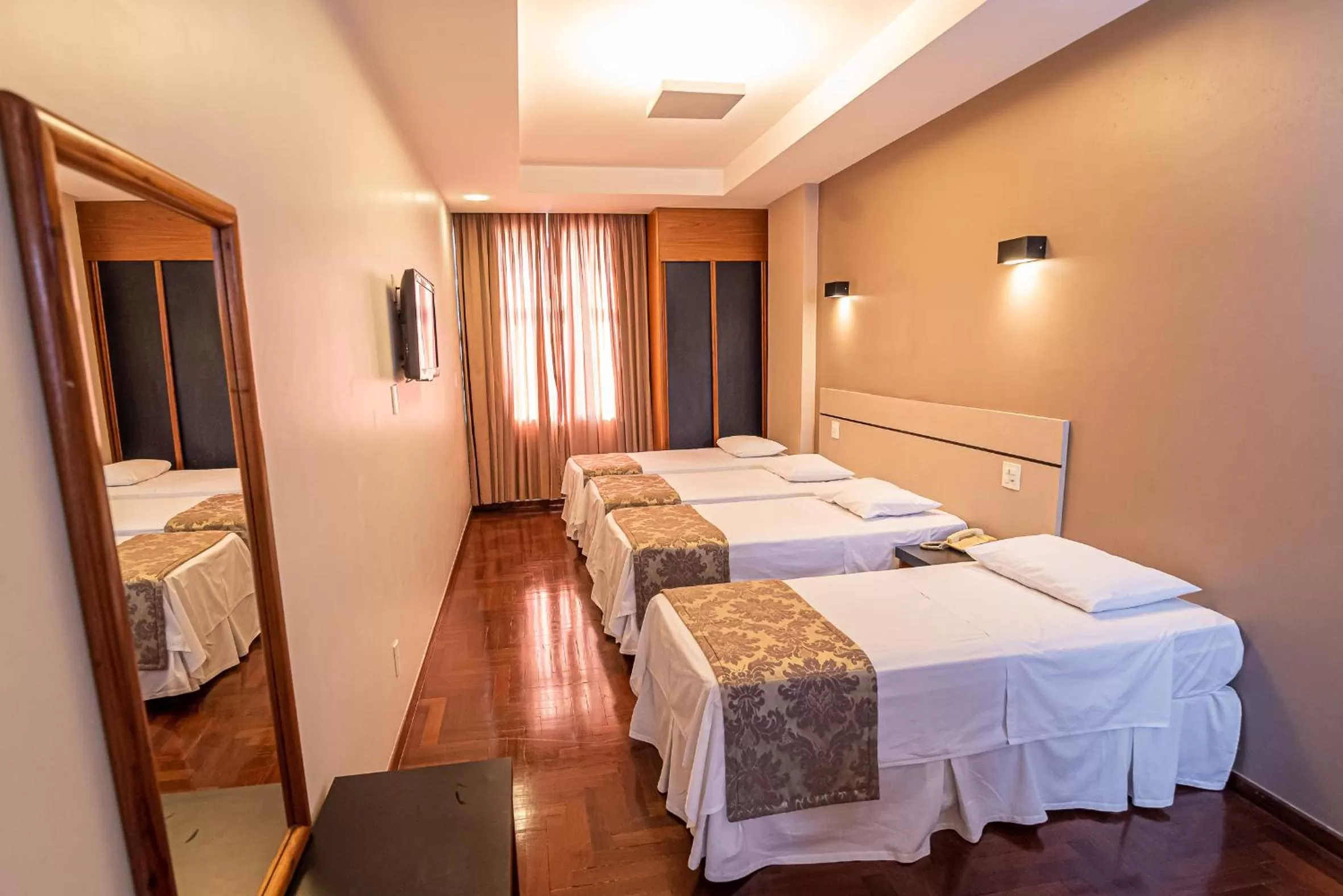 Bed in Serrano Residencial Hotel