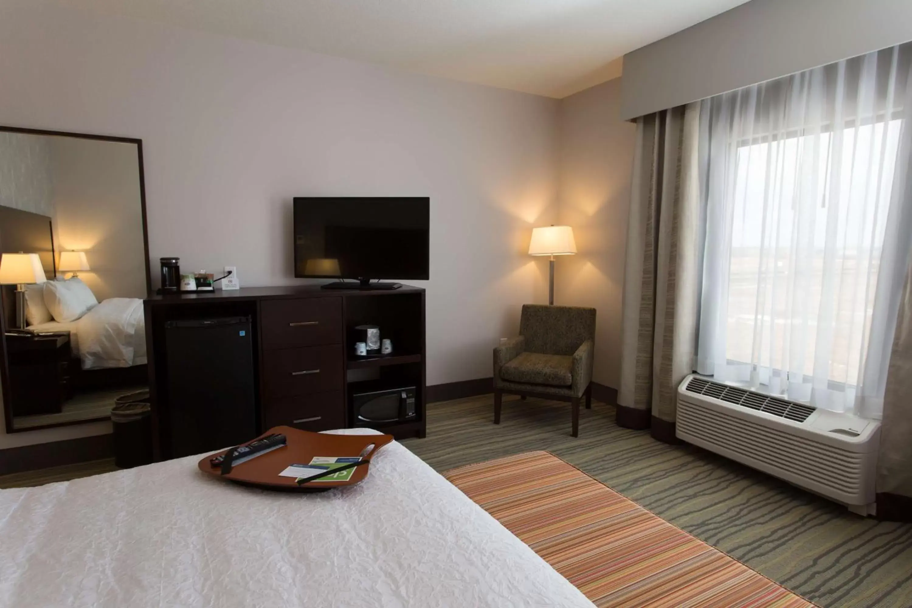 Bed, TV/Entertainment Center in Hampton Inn by Hilton Lloydminster