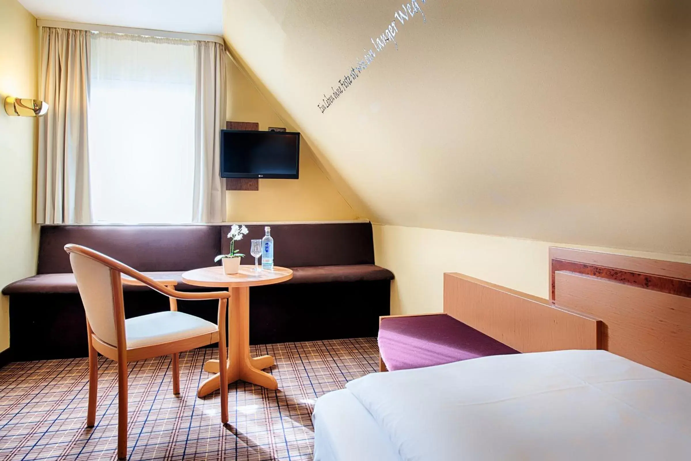 Seating area, Bed in Welcome Hotel Dorf Münsterland