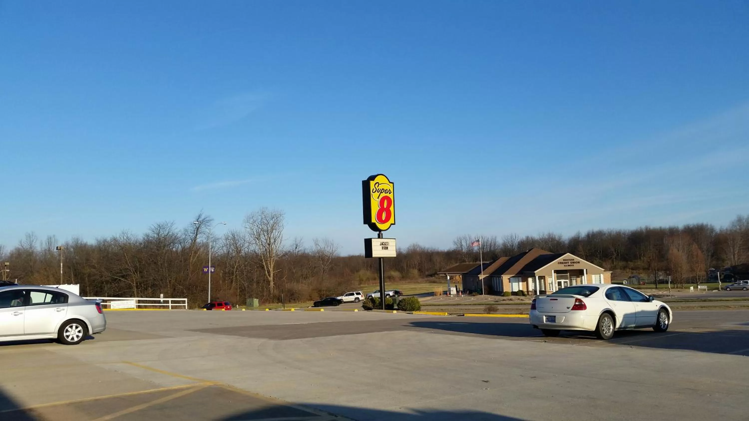 Property logo or sign in Super 8 by Wyndham Macomb