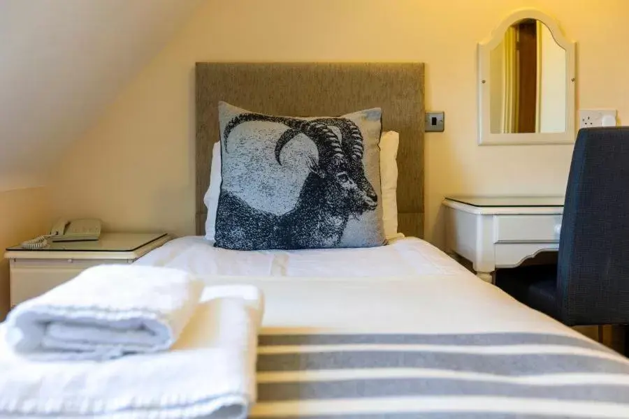 Bed in Swan Revived Hotel