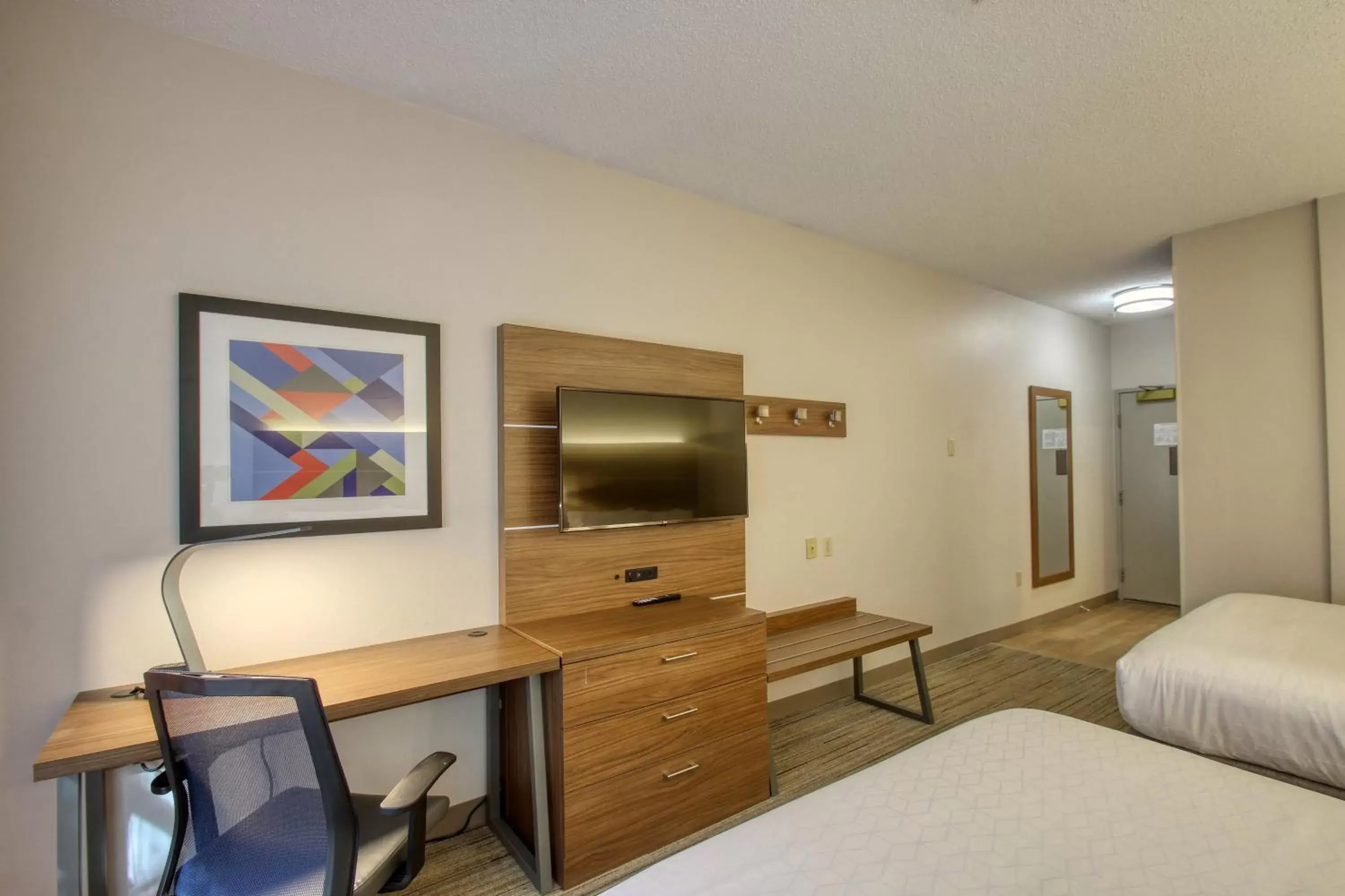 Photo of the whole room, TV/Entertainment Center in Holiday Inn Express Hotel & Suites Oshkosh - State Route 41, an IHG Hotel