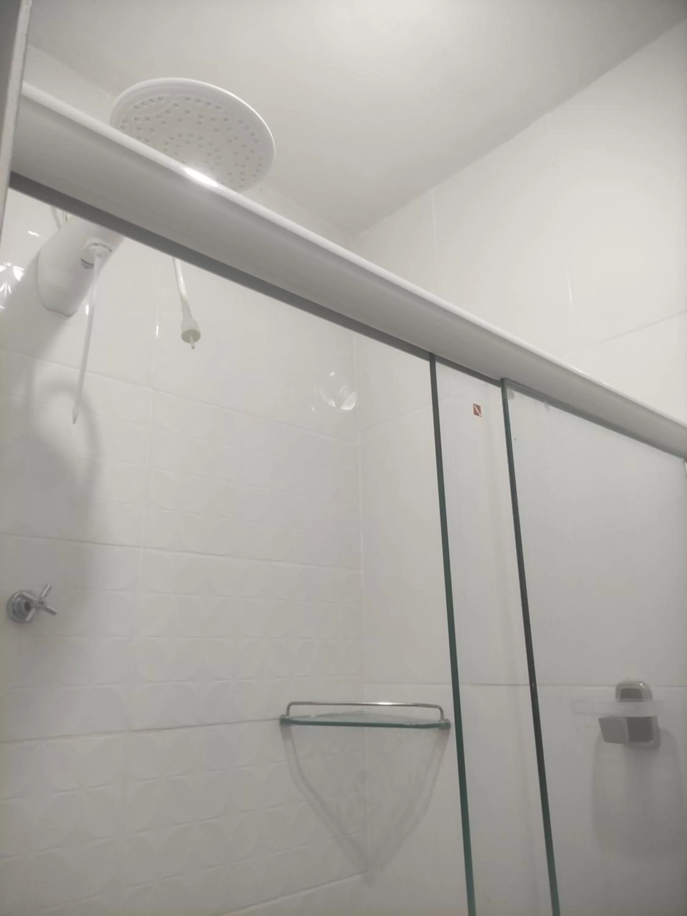 Bathroom in Pousada da Gi Suítes e Turismo