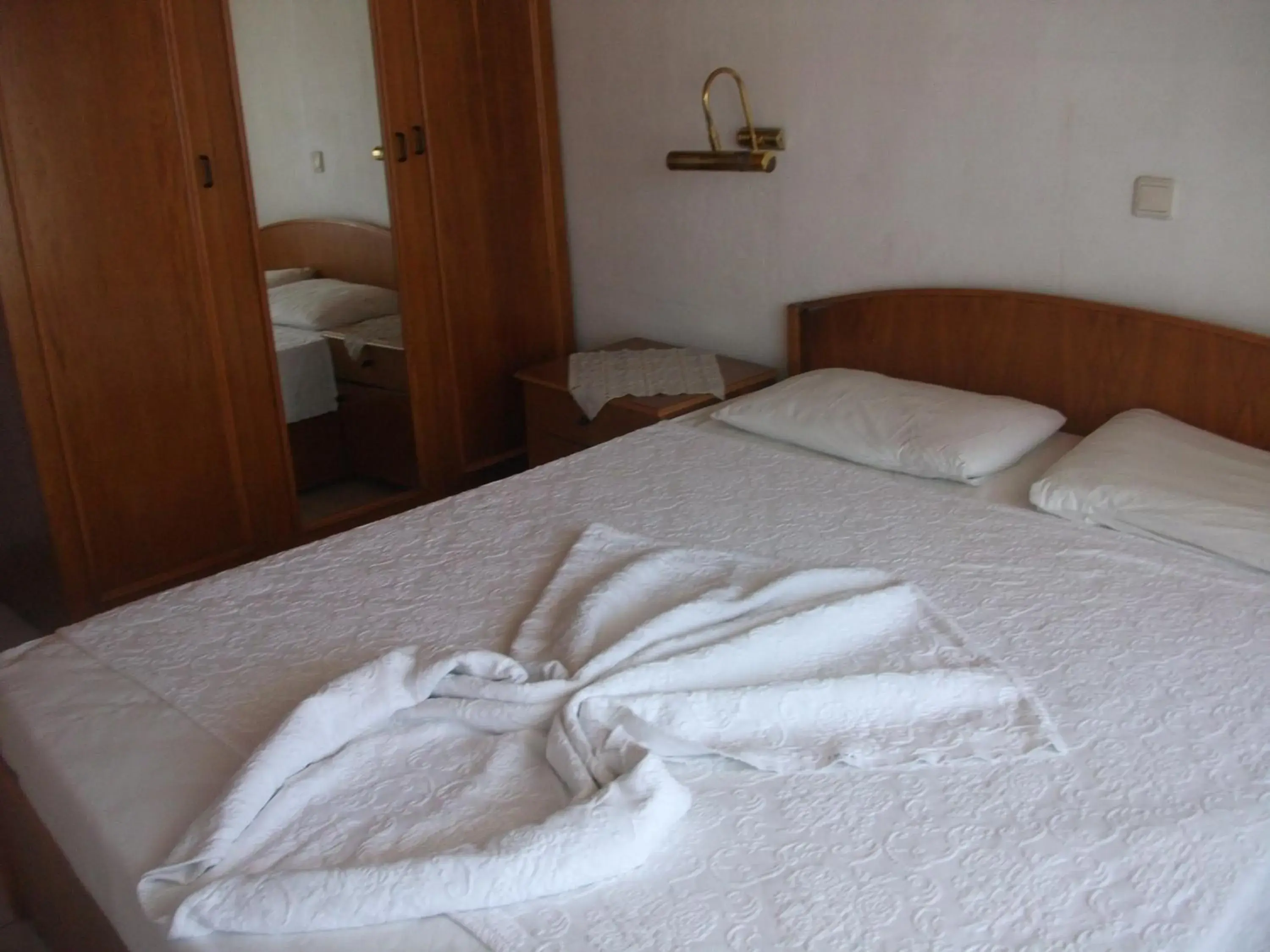 Bed in Delphin Apart Hotel