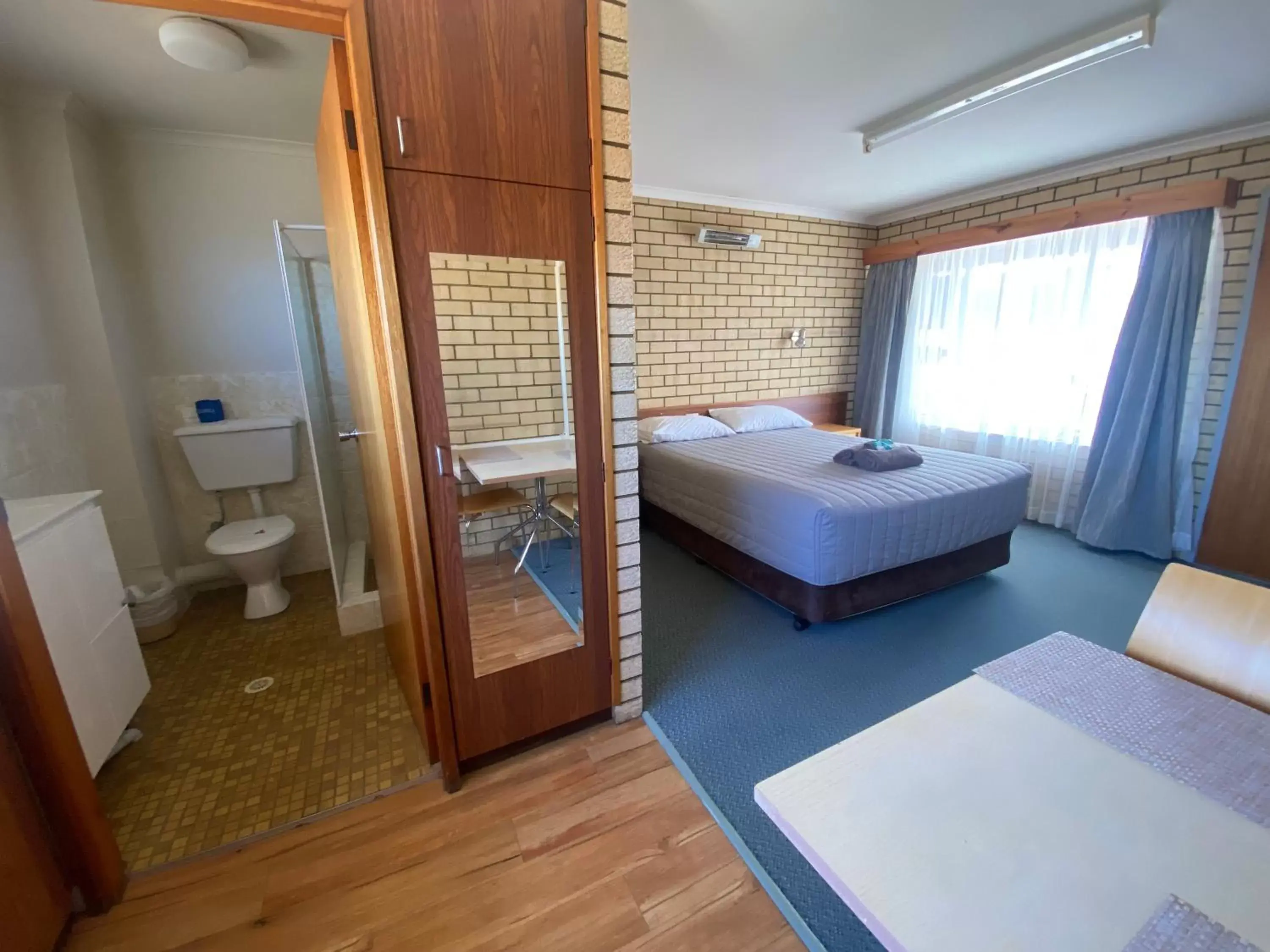 Bed in Coastal Comfort Motel