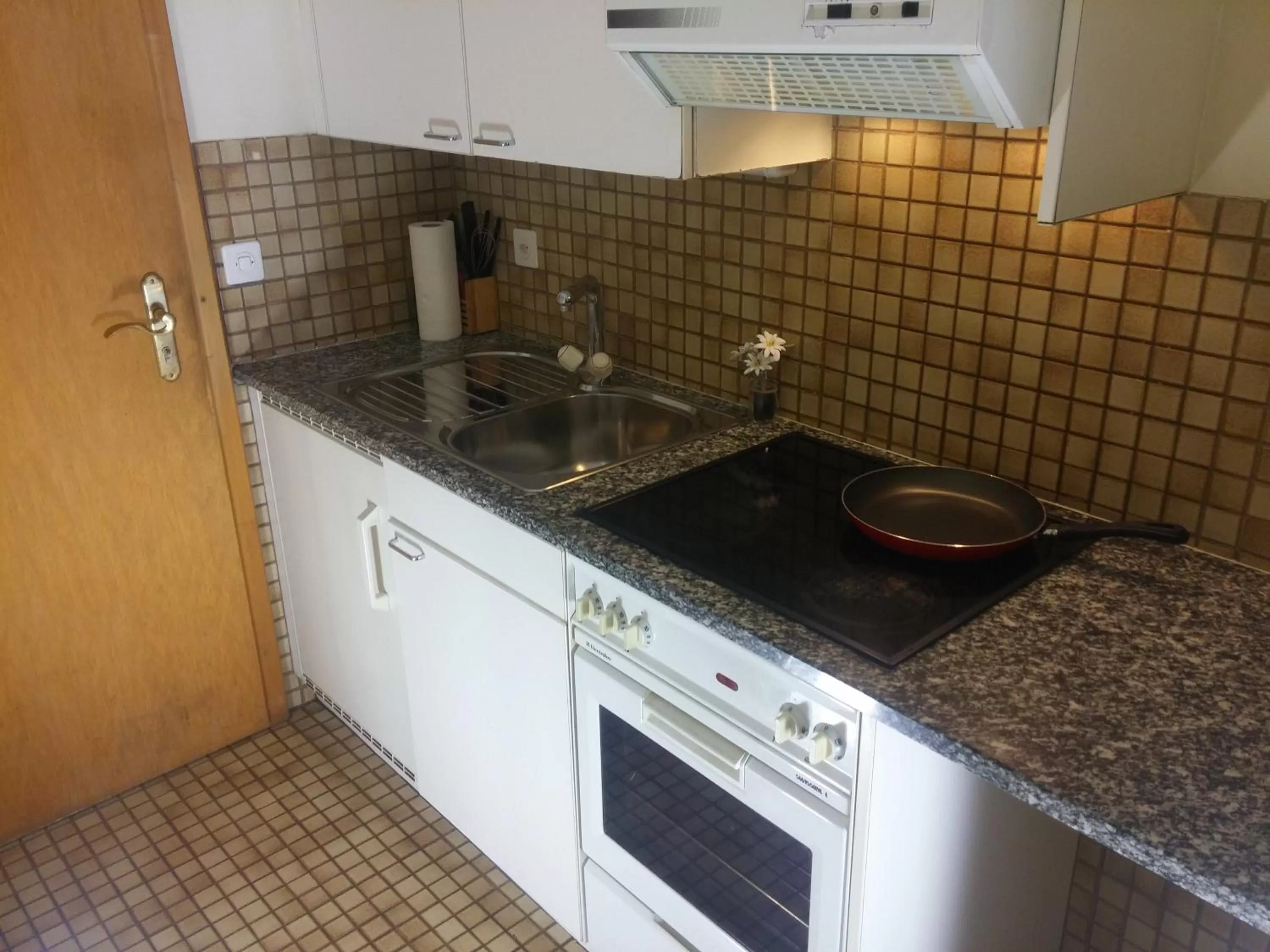 Kitchen or kitchenette in Appart'Hôtel Residence Dizerens