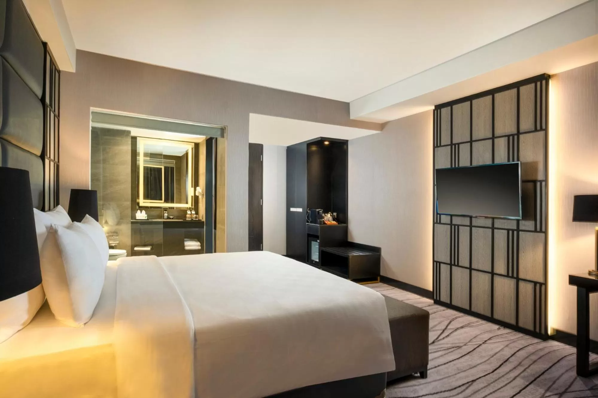 Bed in Grand Swiss-Belhotel Darmo