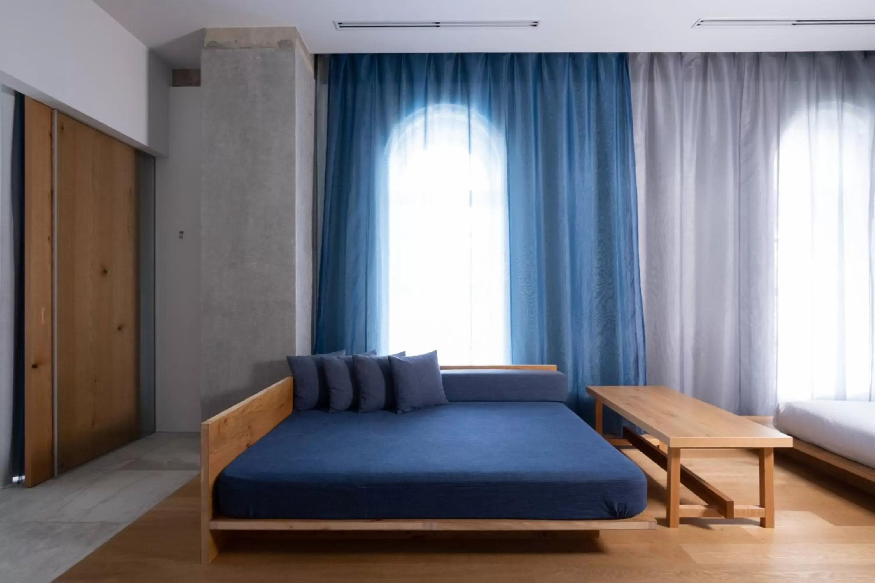 Living room, Bed in TSUGU Kyoto Sanjo by THE SHARE HOTELS