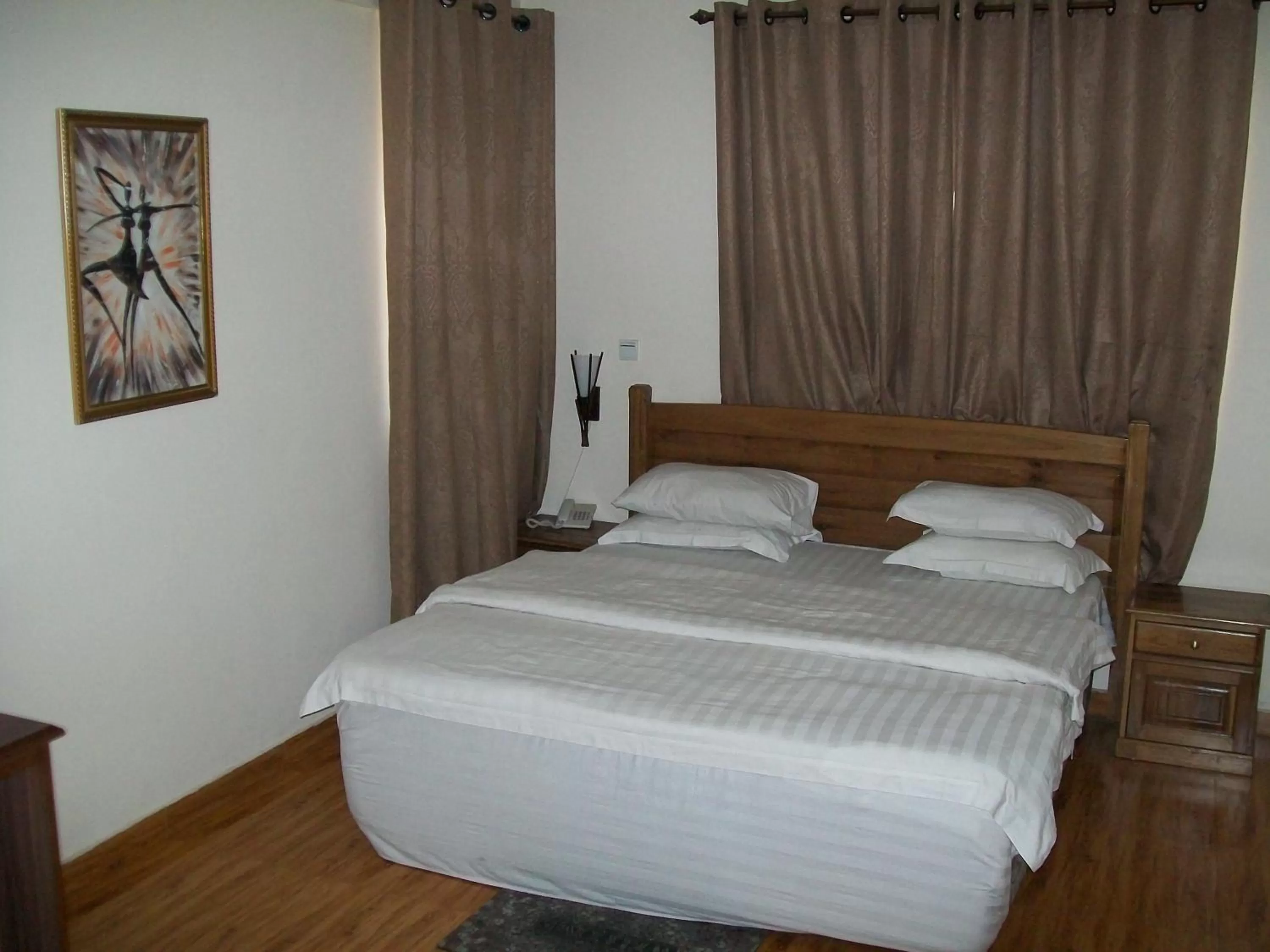 Bed in Ampomaah Hotel