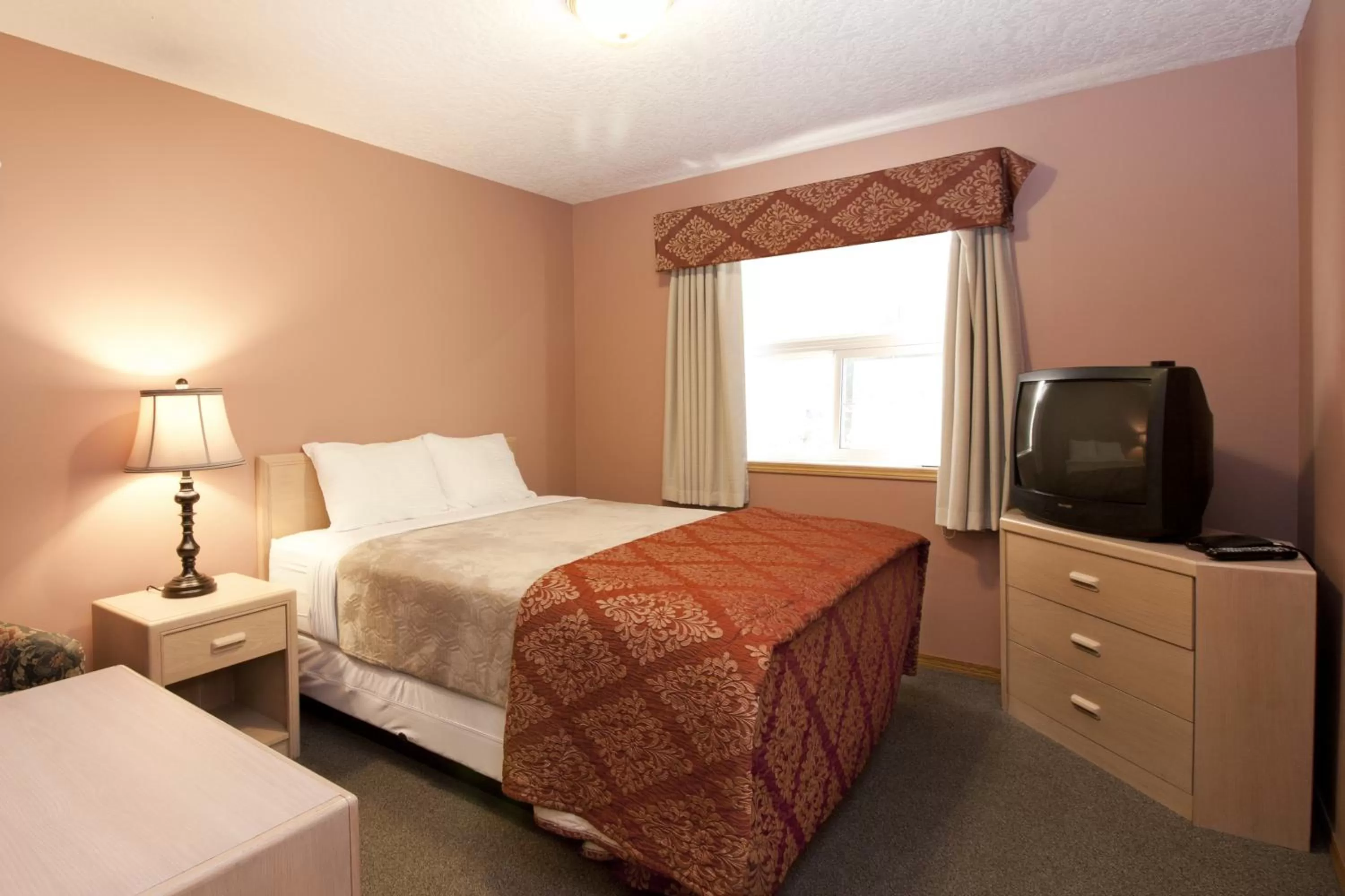 Bed in Bow River Inn