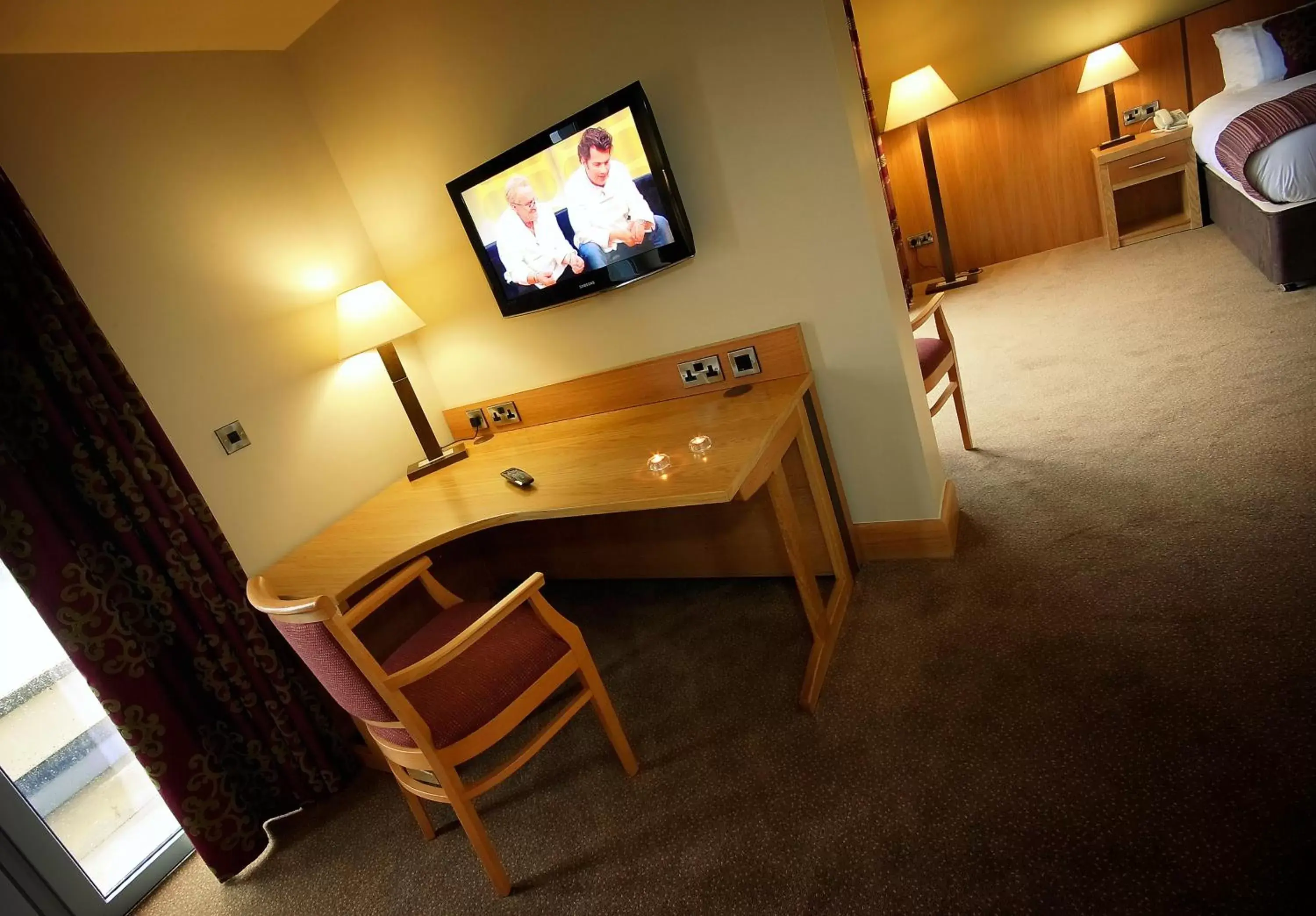 TV and multimedia, TV/Entertainment Center in Belmore Court & Motel