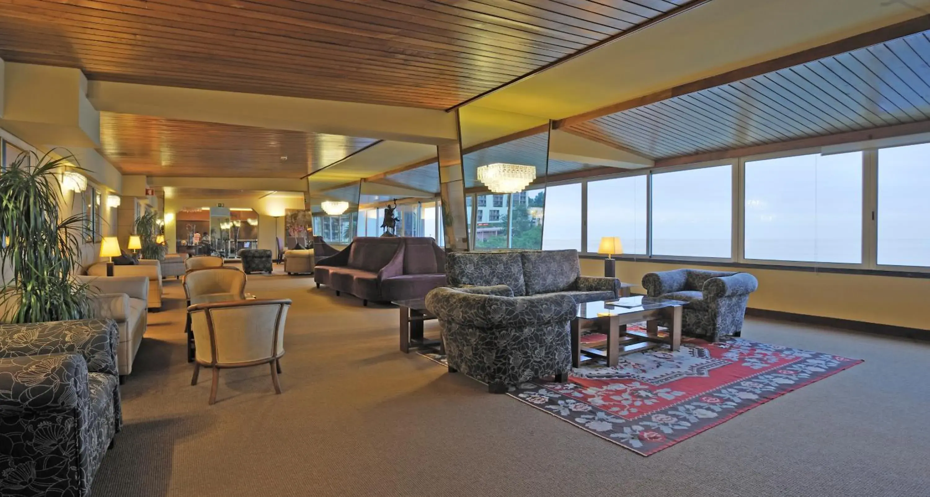 Communal lounge/ TV room in Pestana Carlton Madeira Ocean Resort Hotel