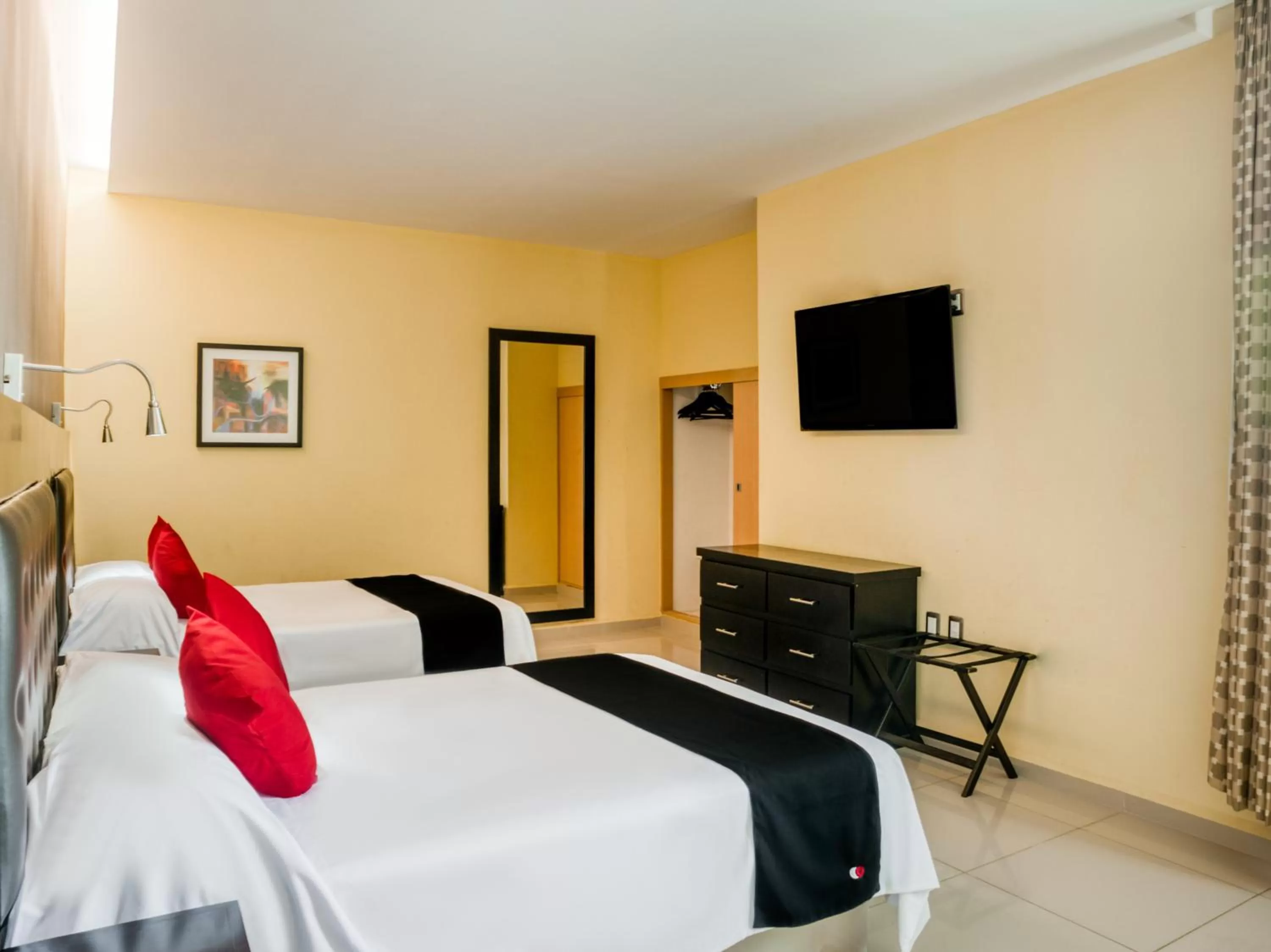 Bed in Veracruz Suites Hotel