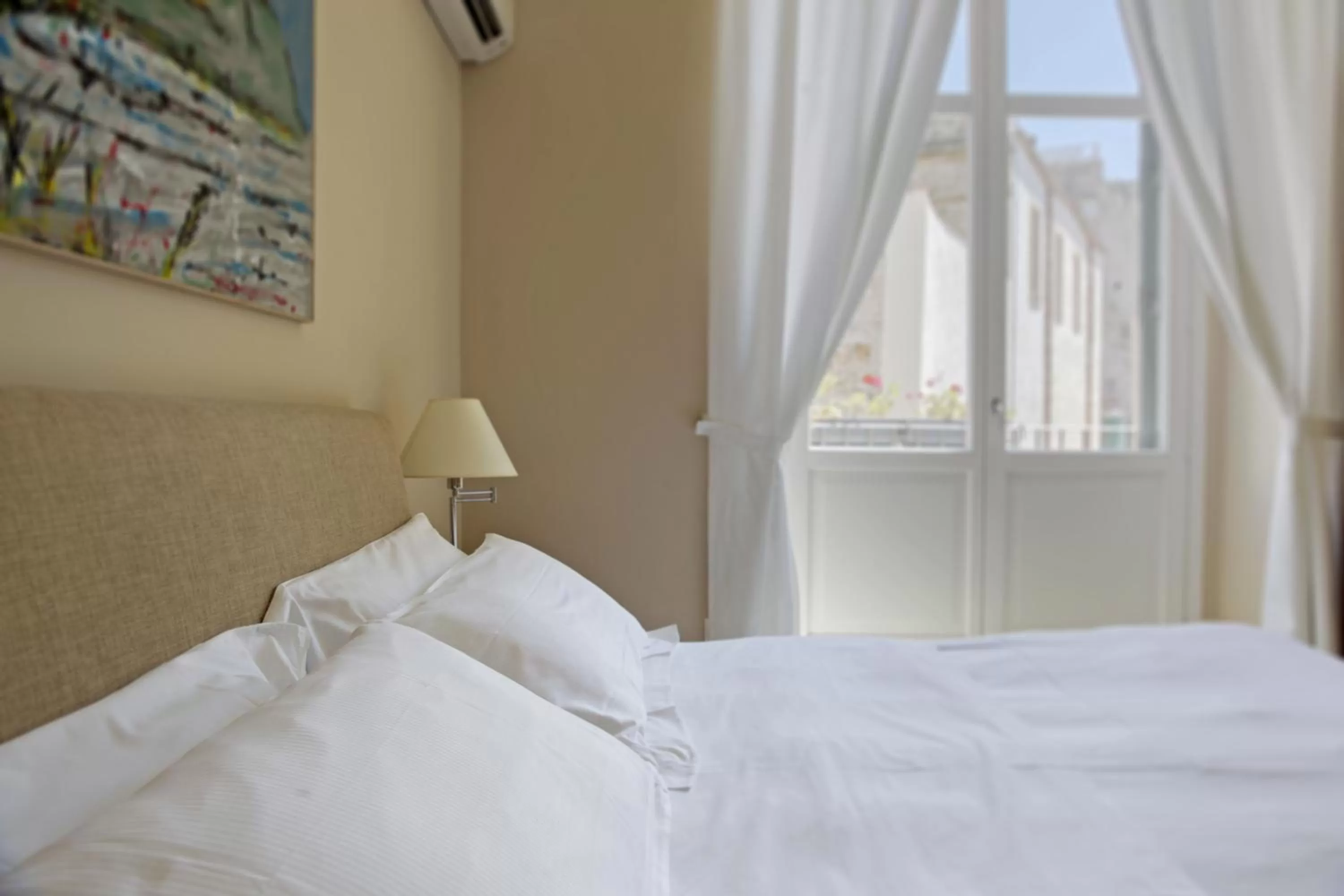 Bed in Palazzo Brunaccini Boutique Hotel