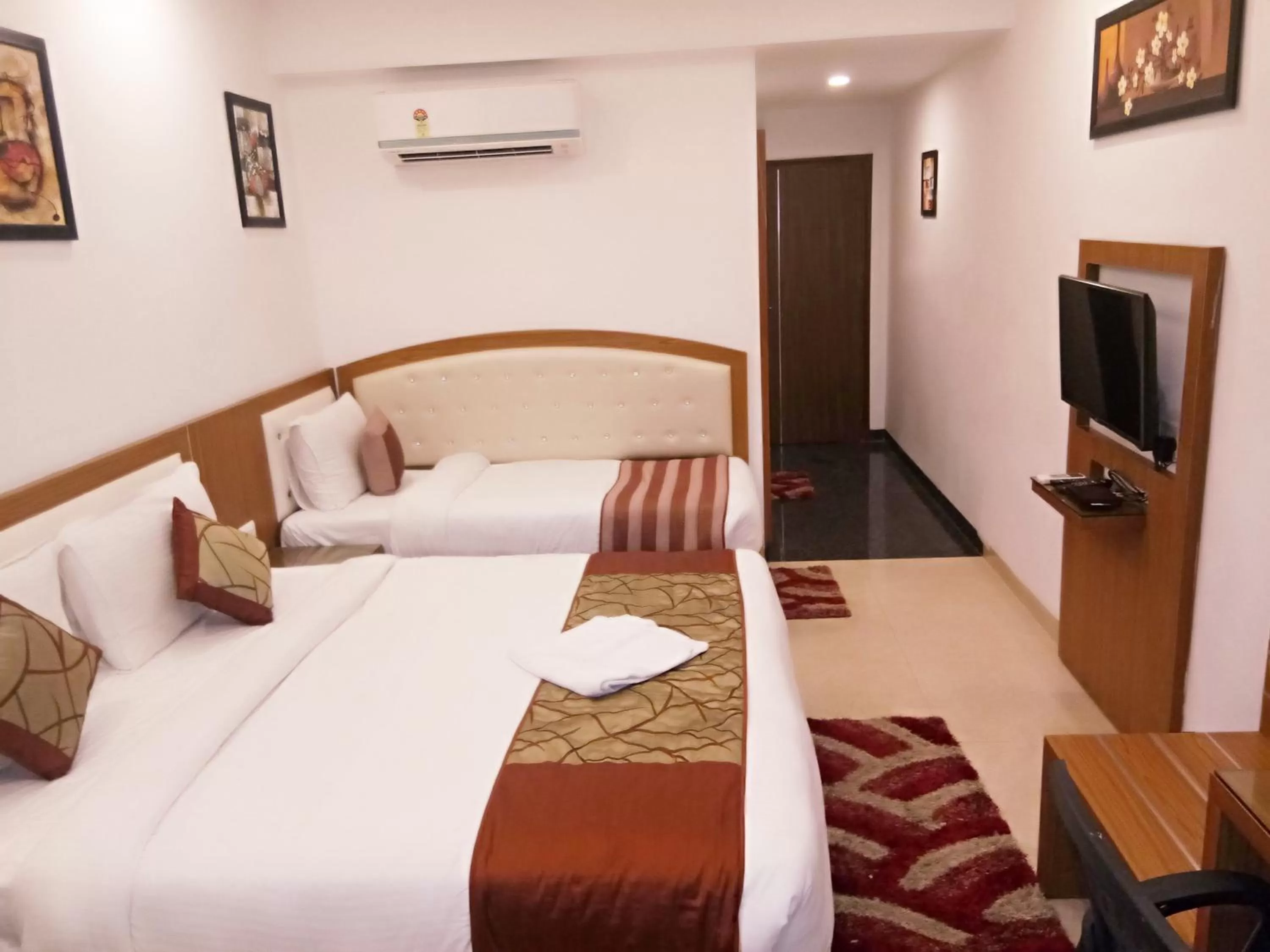 Bed in Hotel Suktara International
