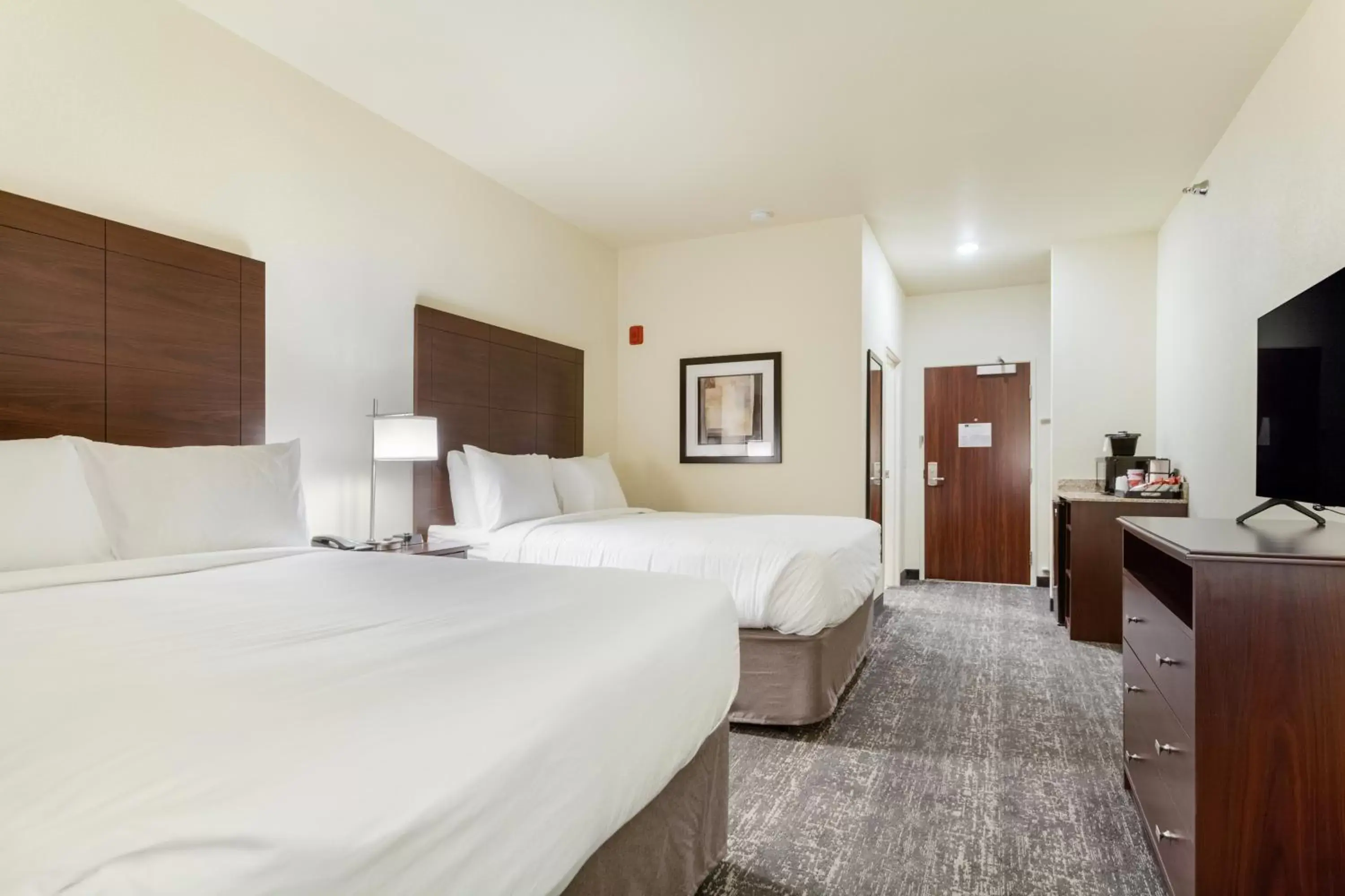 Bed in Cobblestone Hotel & Suites - Cozad