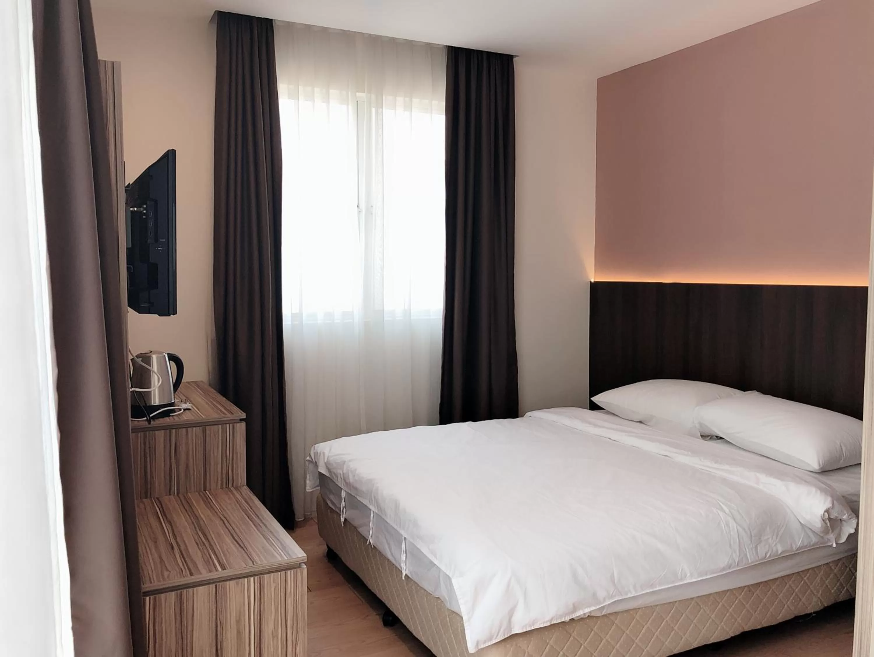 Bed in Tumike Hotel Bentong