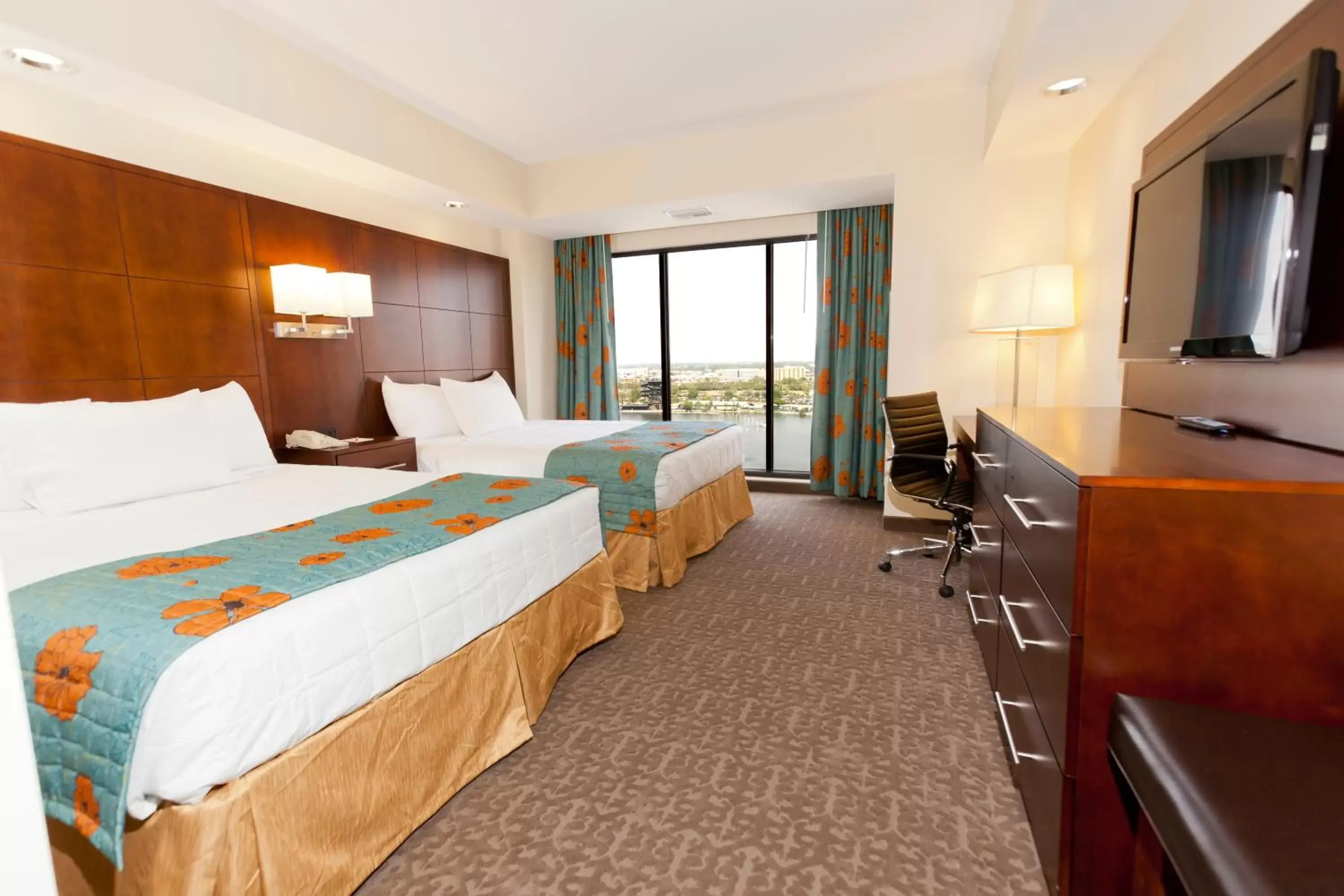 Bedroom in Ramada Plaza by Wyndham Orlando Resort & Suites Intl Drive