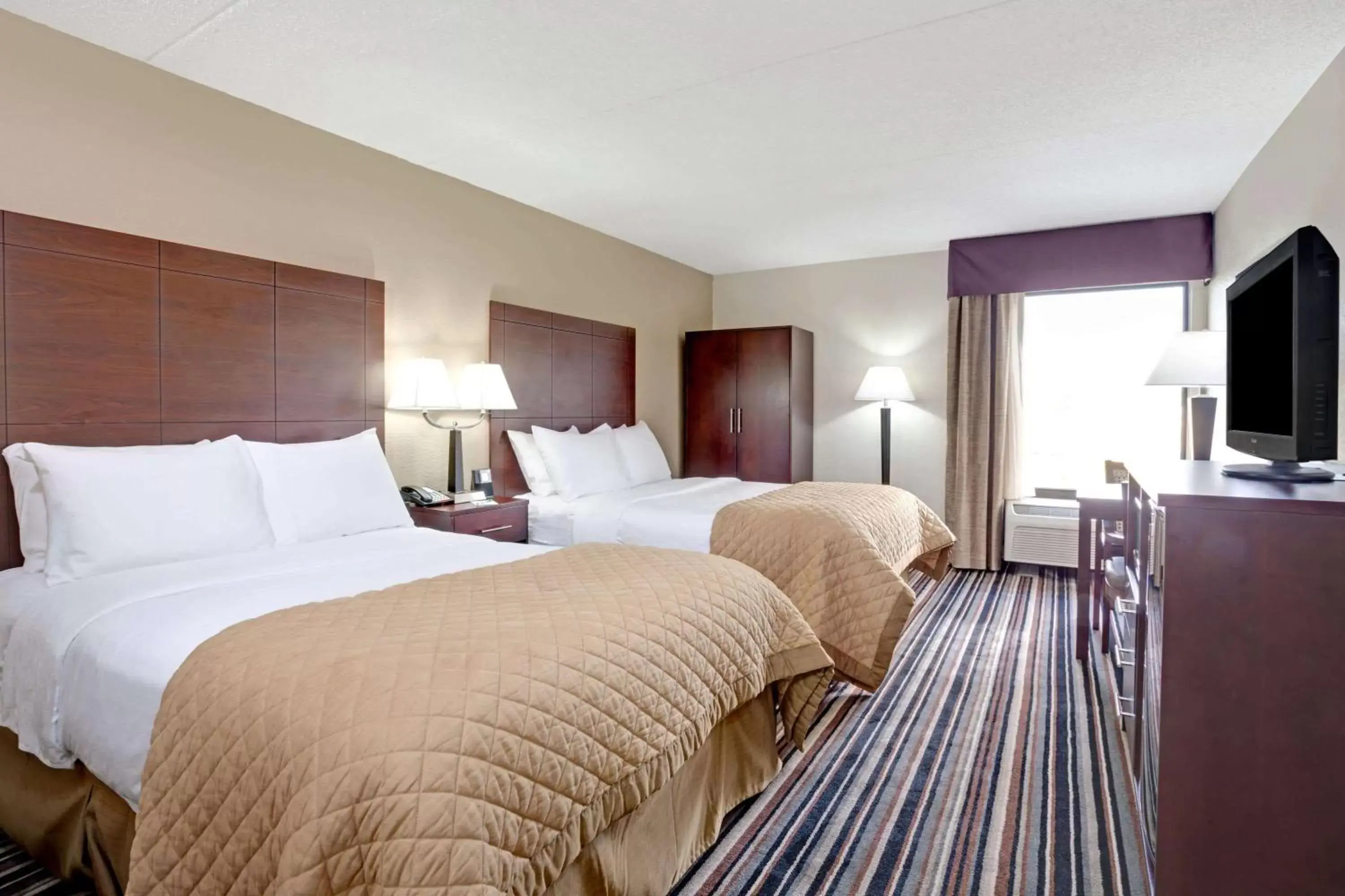 Photo of the whole room, Bed in Wyndham Garden Charlotte Airport Southeast