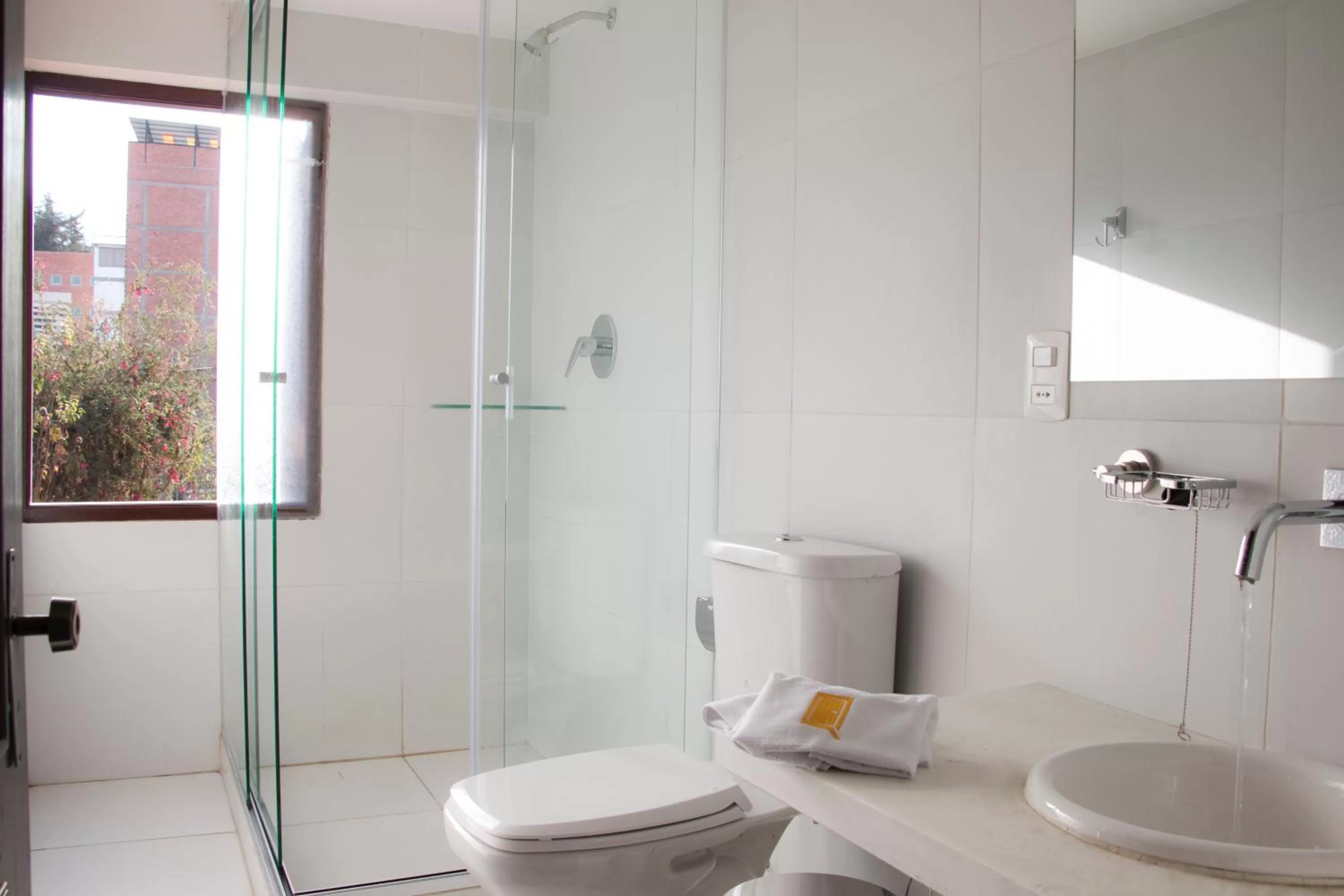 Shower in Qhini Hotel Boutique