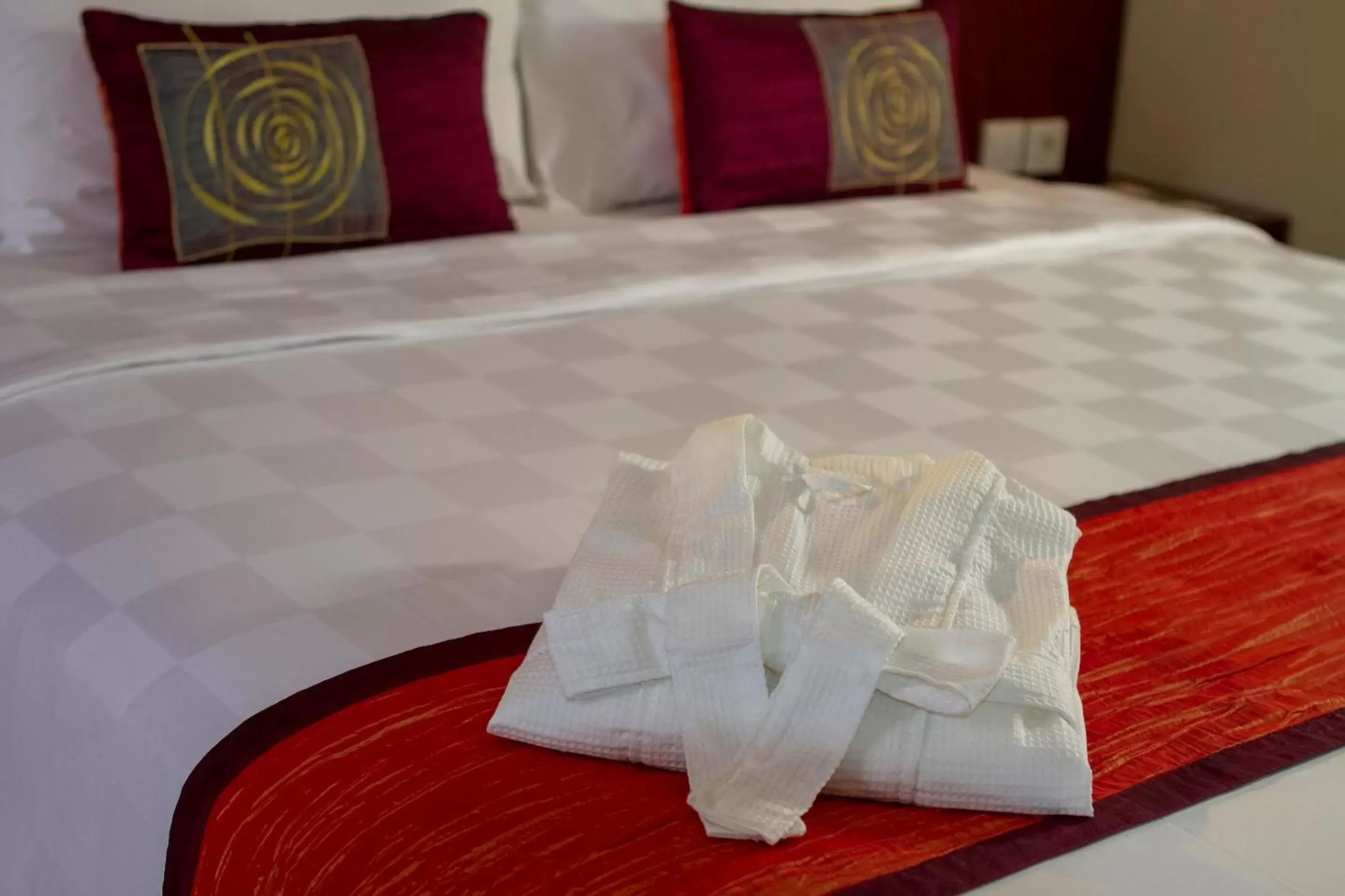 Bed in PrimeBiz Hotel Kuta