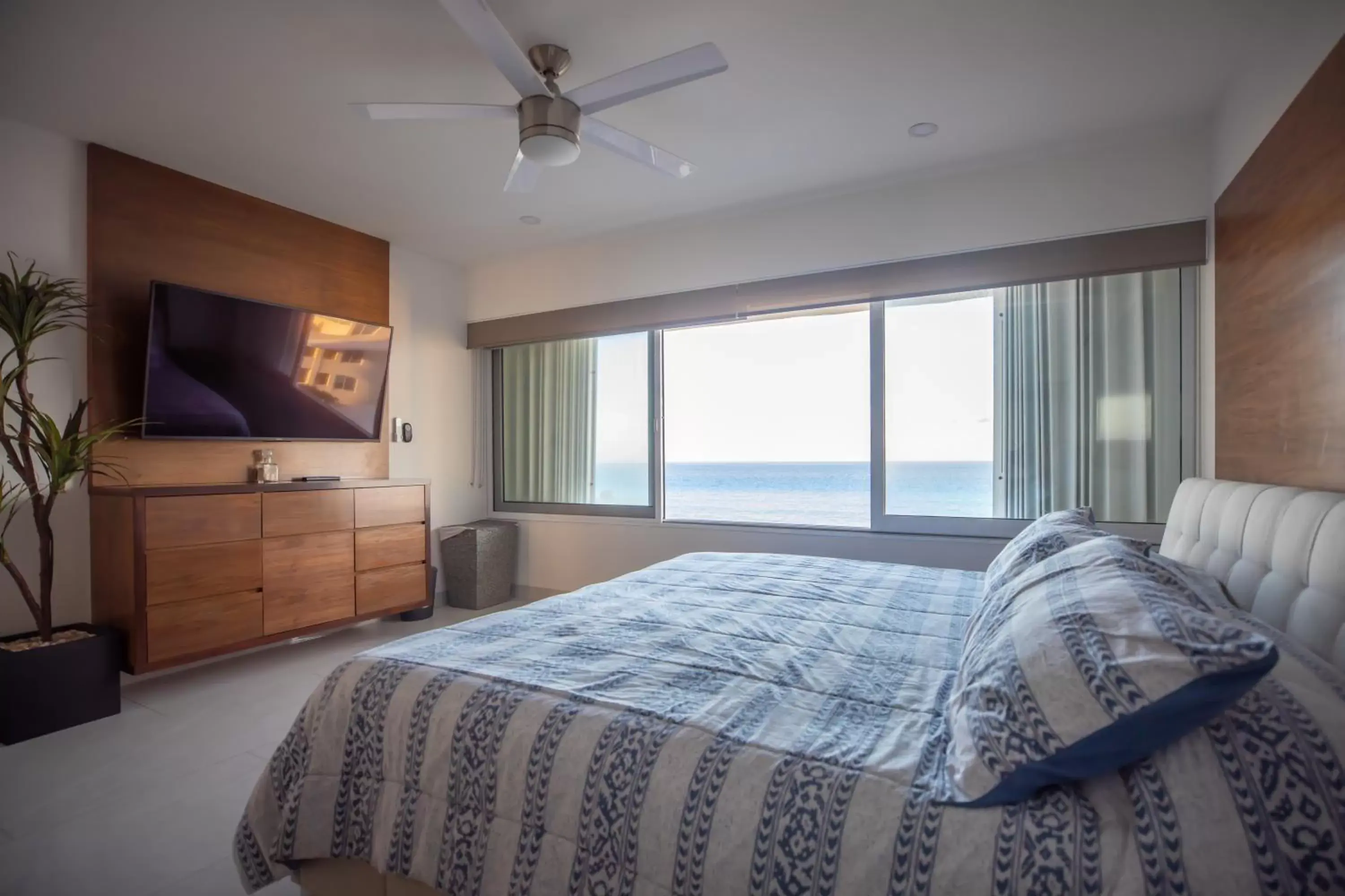 Bed in Beachfront Penthouses by LivIN Cancun