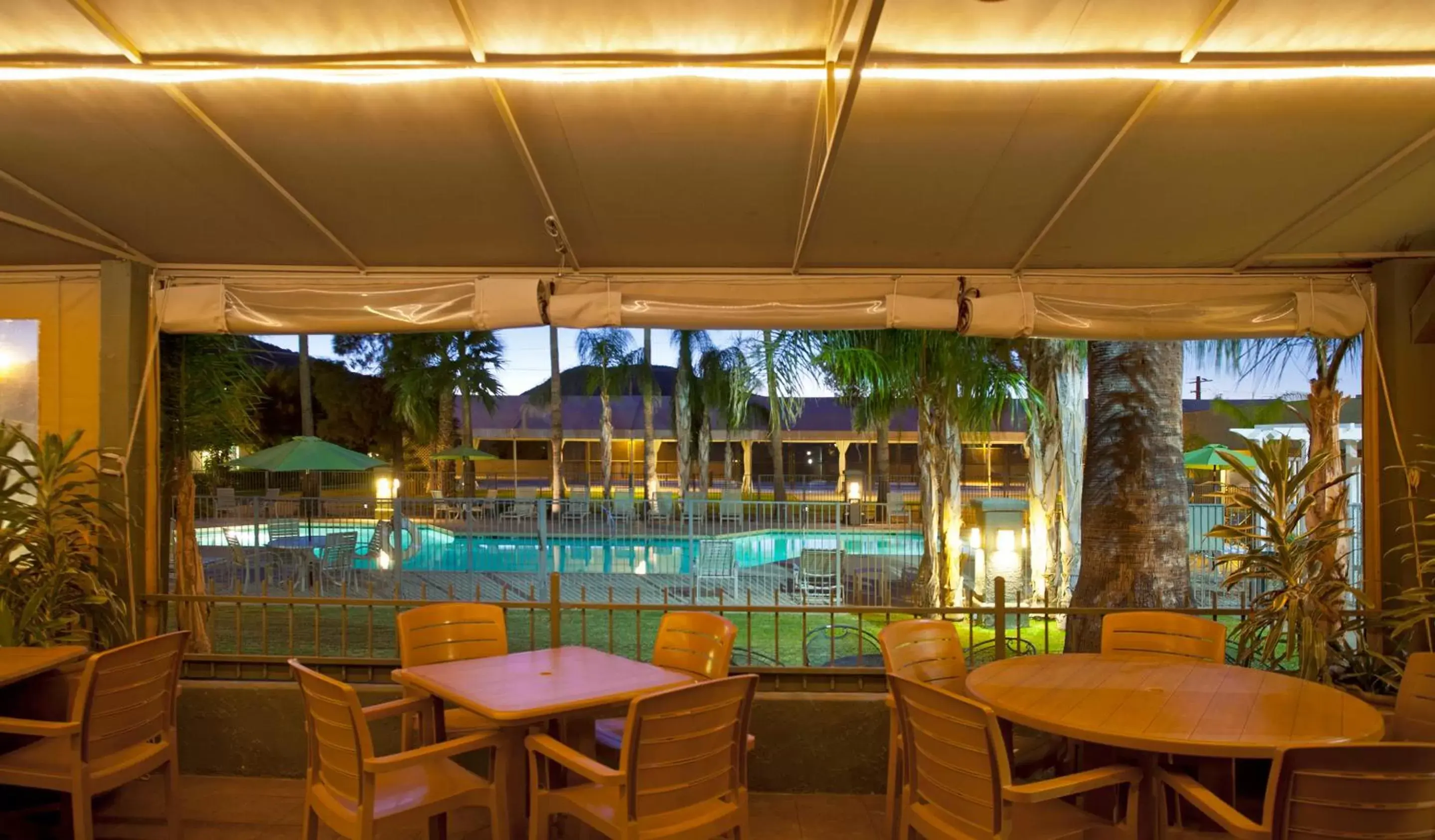 Lounge or bar, Swimming Pool in Ramada by Wyndham Tucson