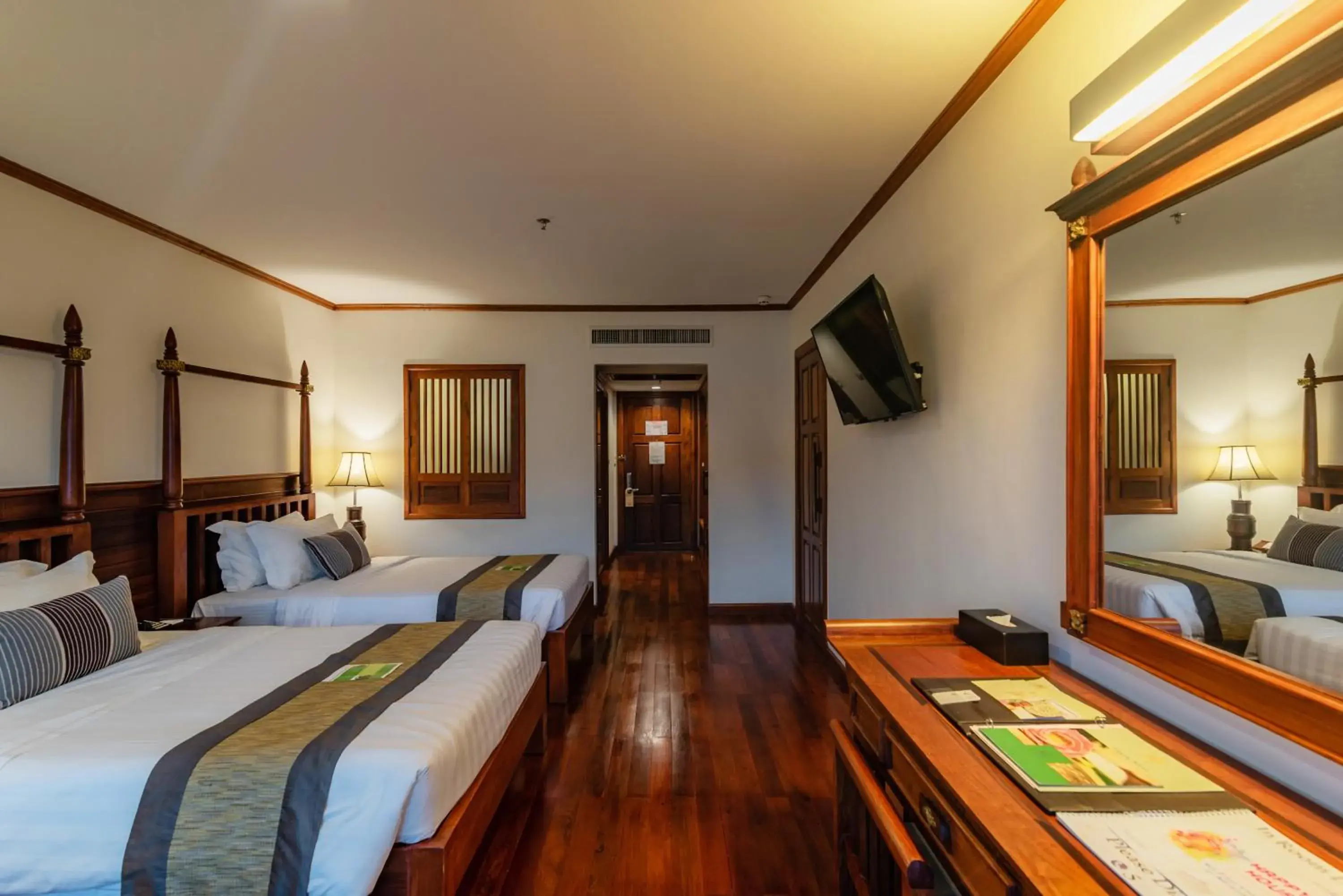 Bed in Empress Residence Resort and Spa