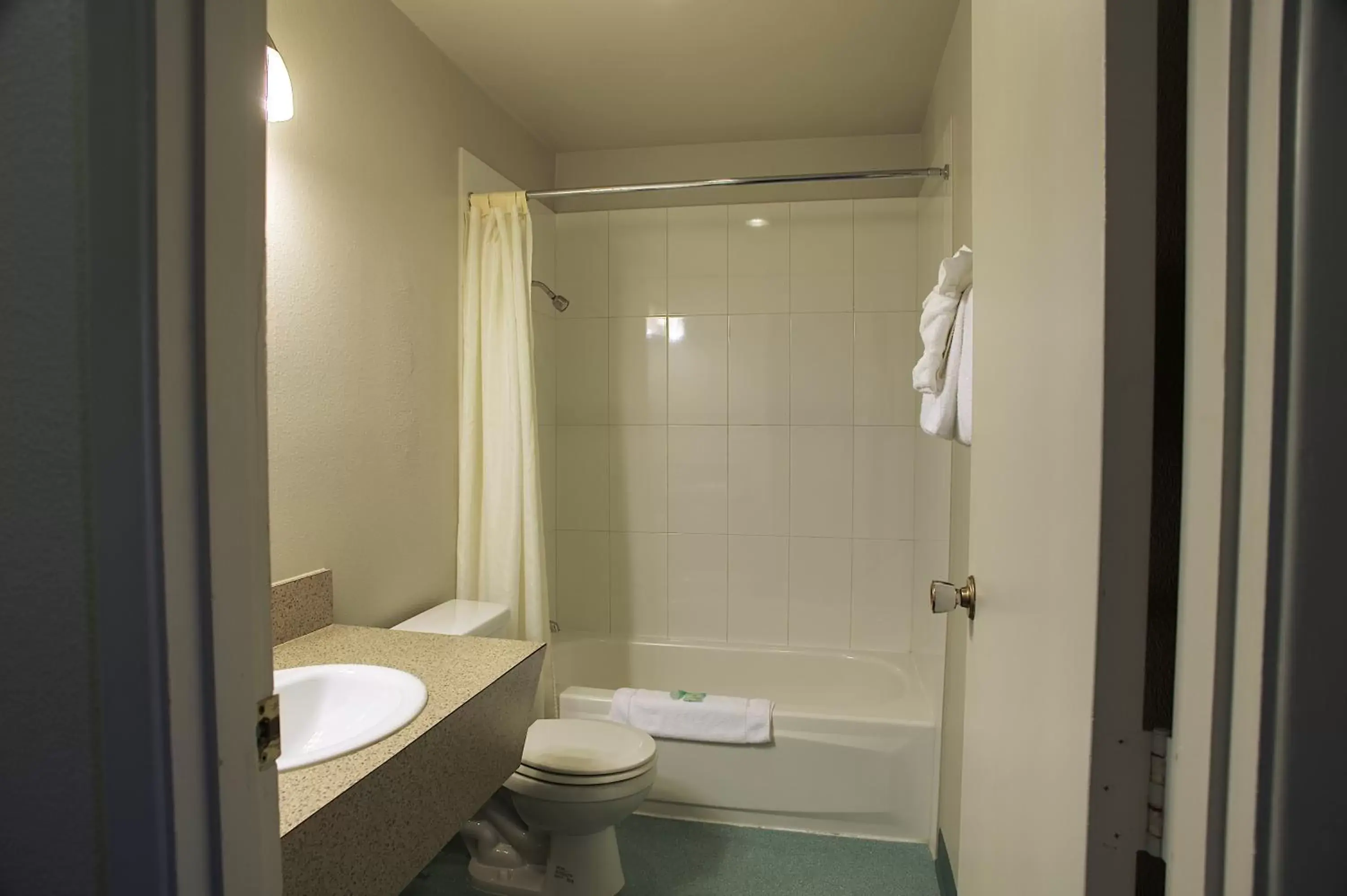 Bathroom in Aladdin Inn and Suites