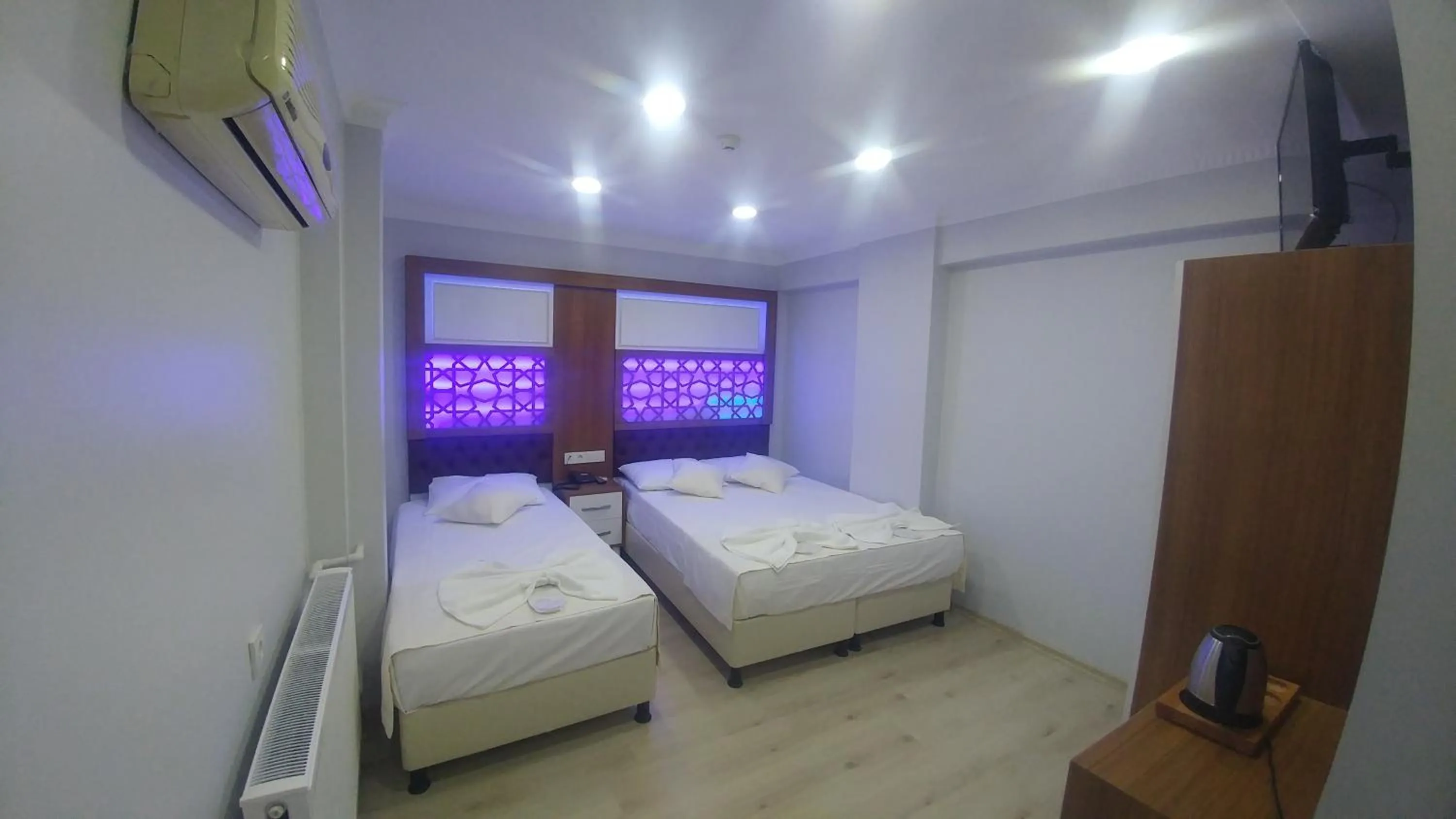 Bed in Grand Liza Hotel