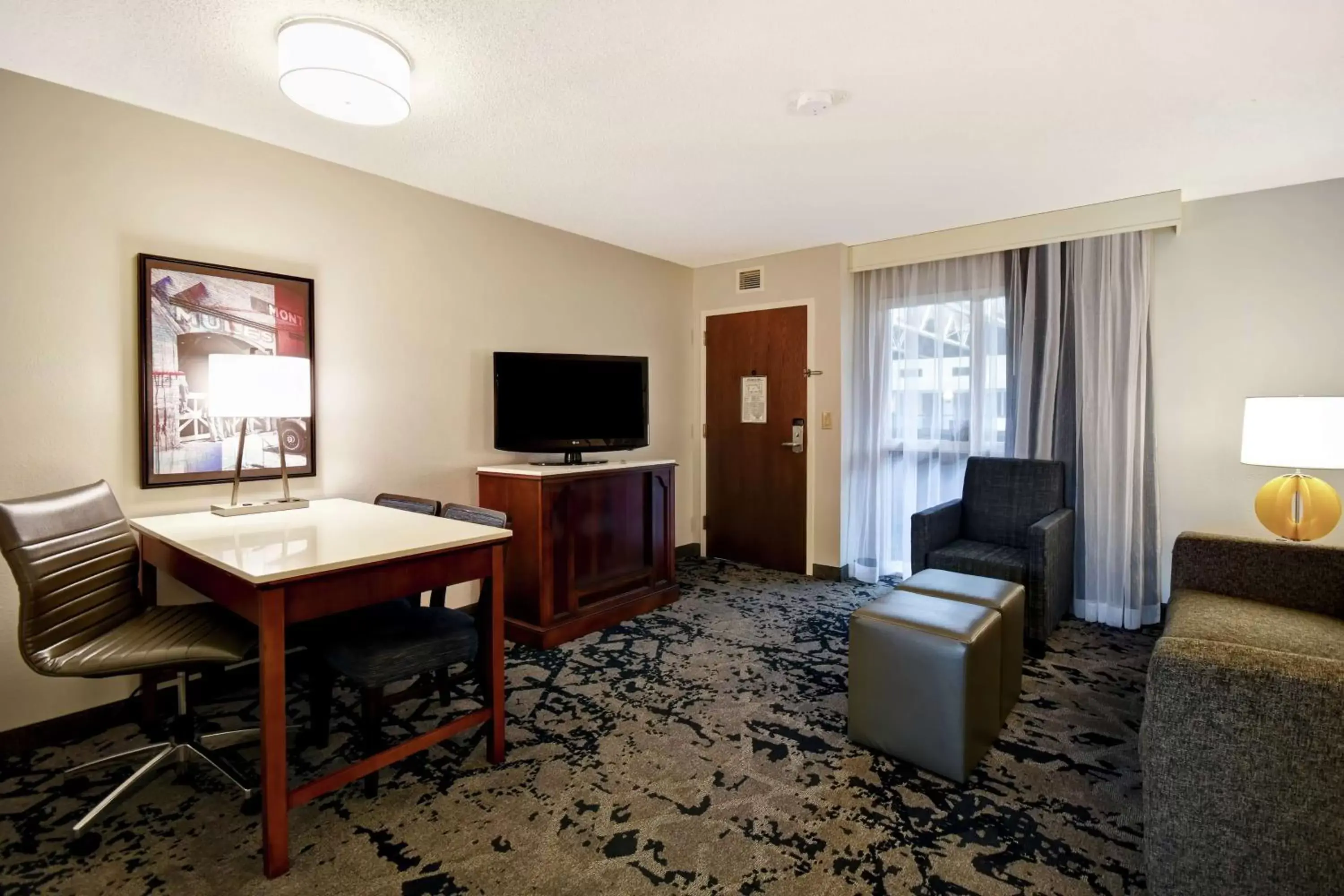 Bedroom, TV/Entertainment Center in Embassy Suites Montgomery - Hotel & Conference Center