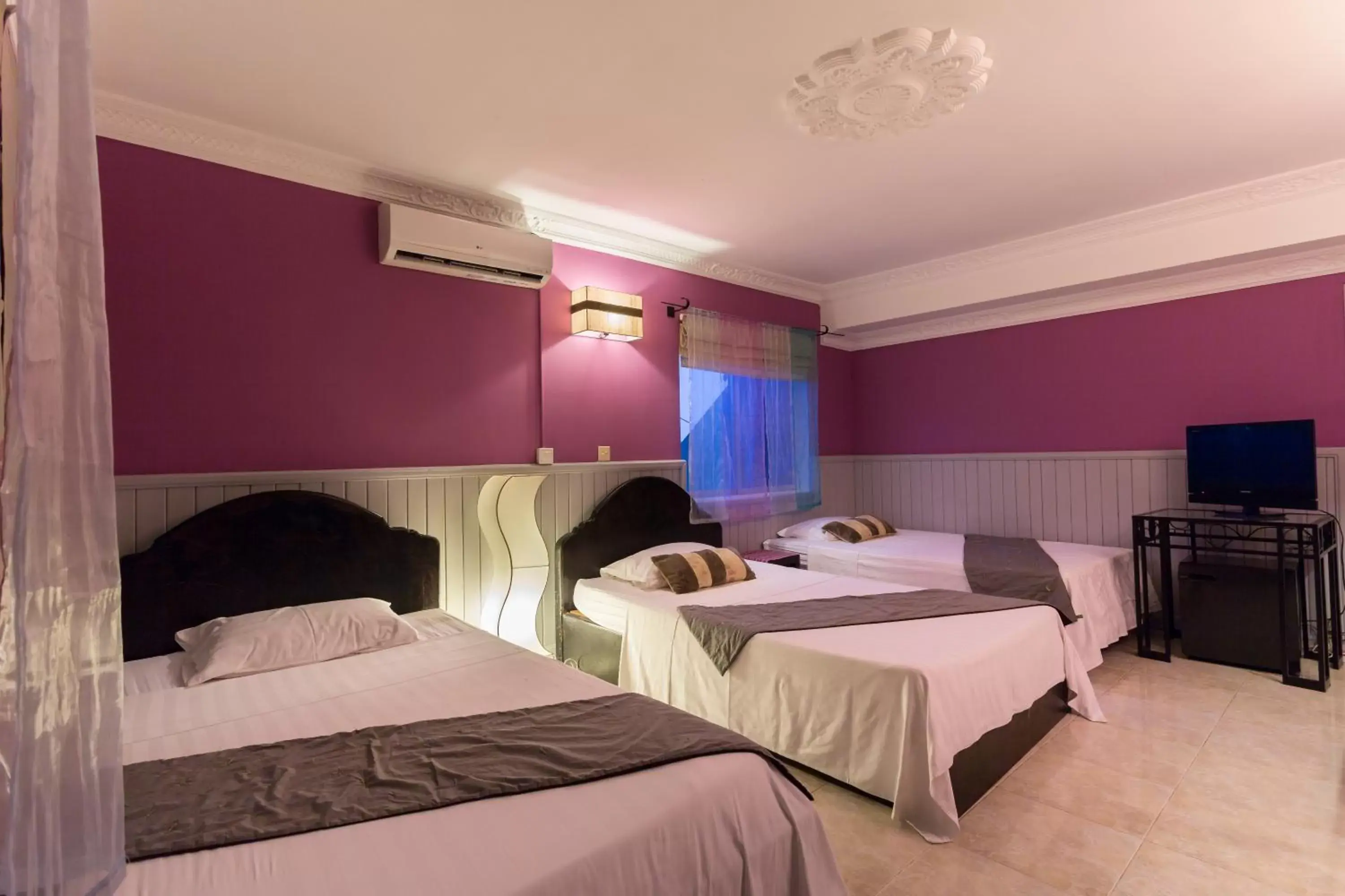 Deluxe Triple Room in Le Tigre Villa Deluxe Triple Room in Le Tigre Villa